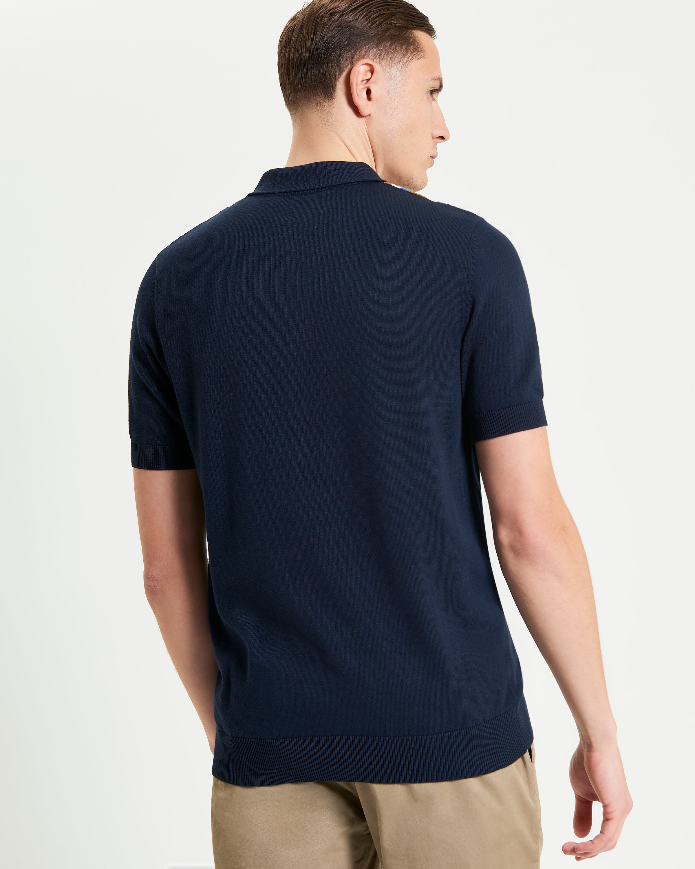 Vertical Stripe Polo – Navy – Back view showcasing lightweight cotton knit design.