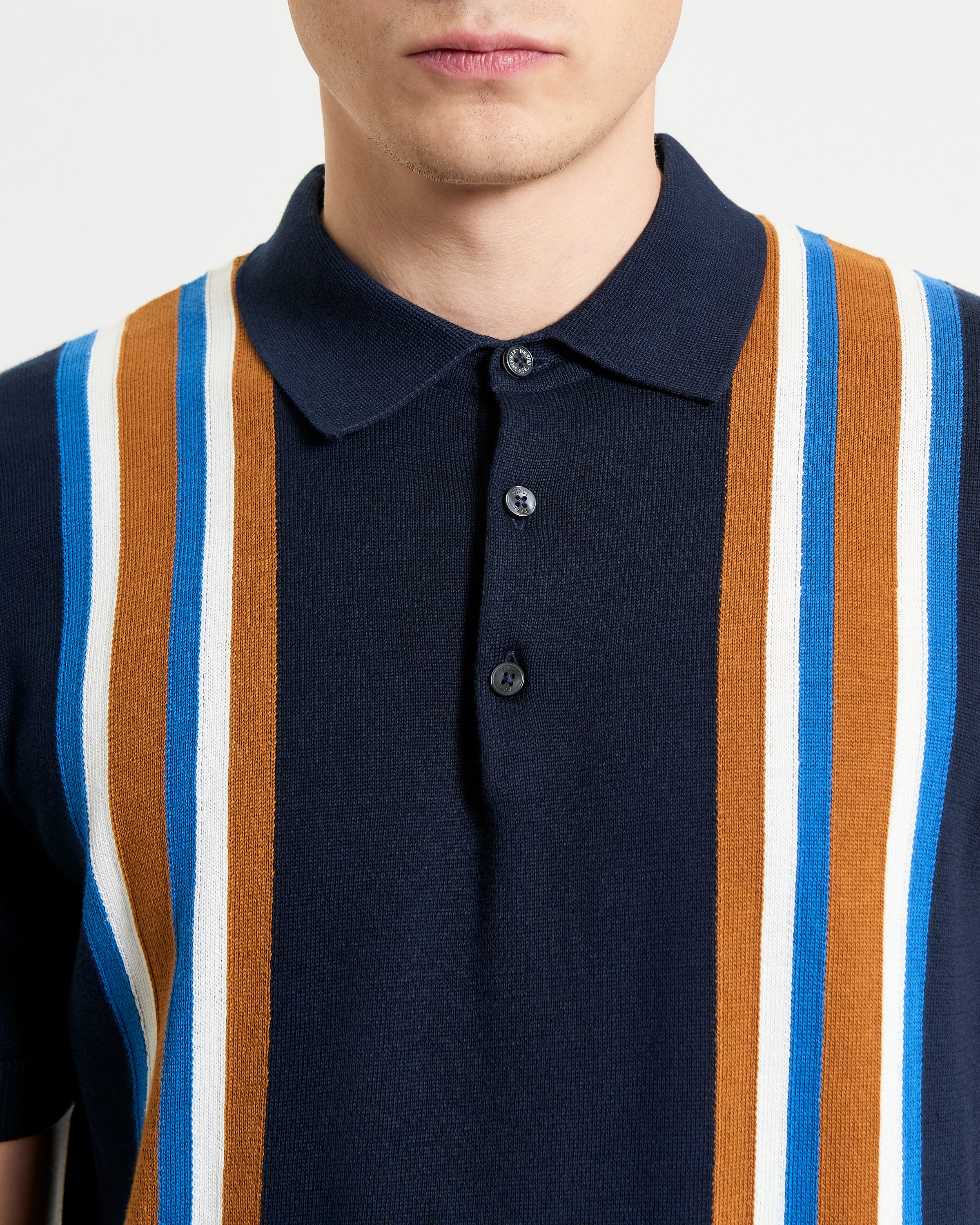 Vertical Stripe Polo – navy with bold vertical stripes and three-button placket for effortless weekend style.