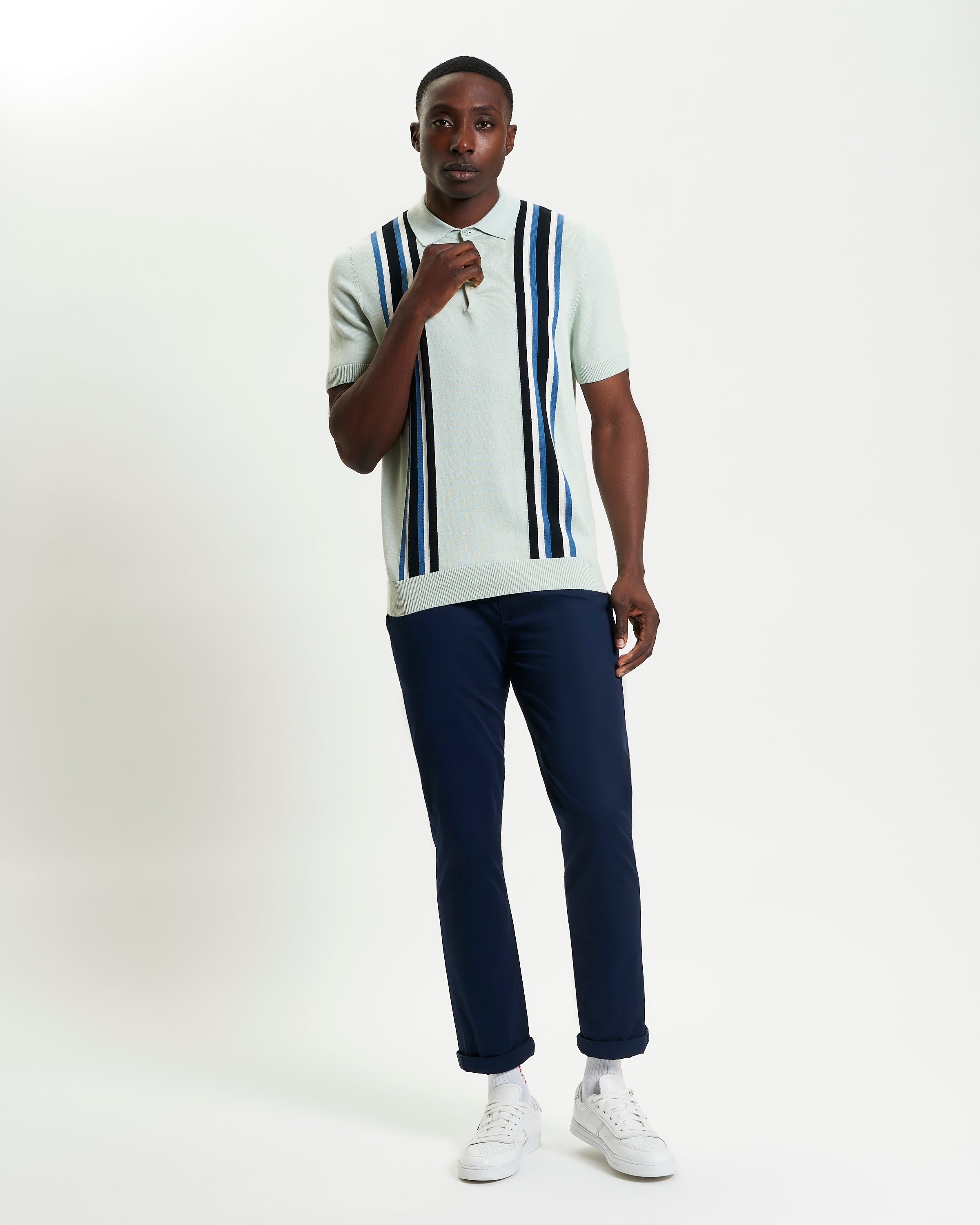 Vertical Stripe Polo – Bold vertical stripes and a three-button placket, perfect for stylish weekend looks.