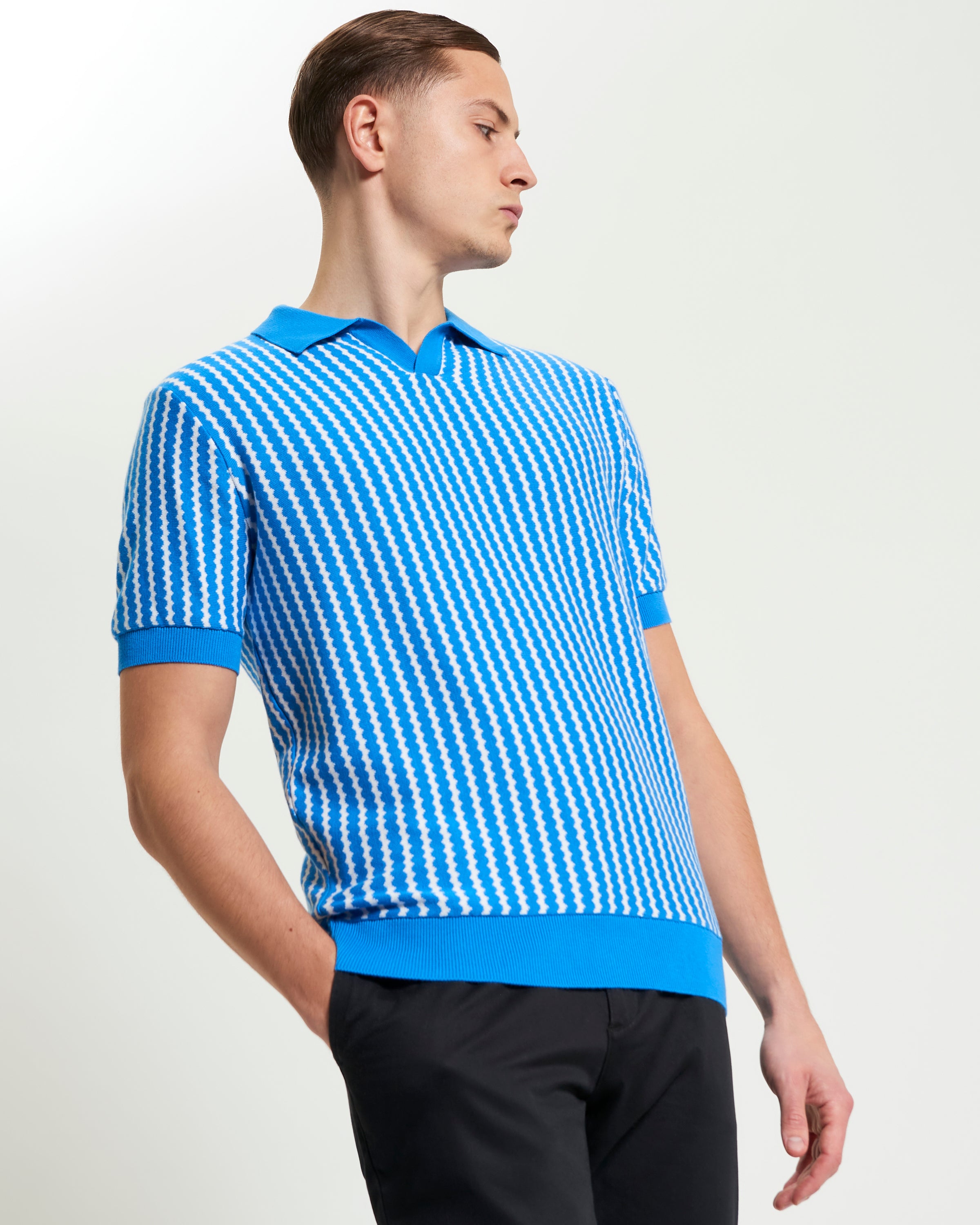 Vertical Wave Polo – Blue short-sleeve polo with vertical wave pattern and open neckline.