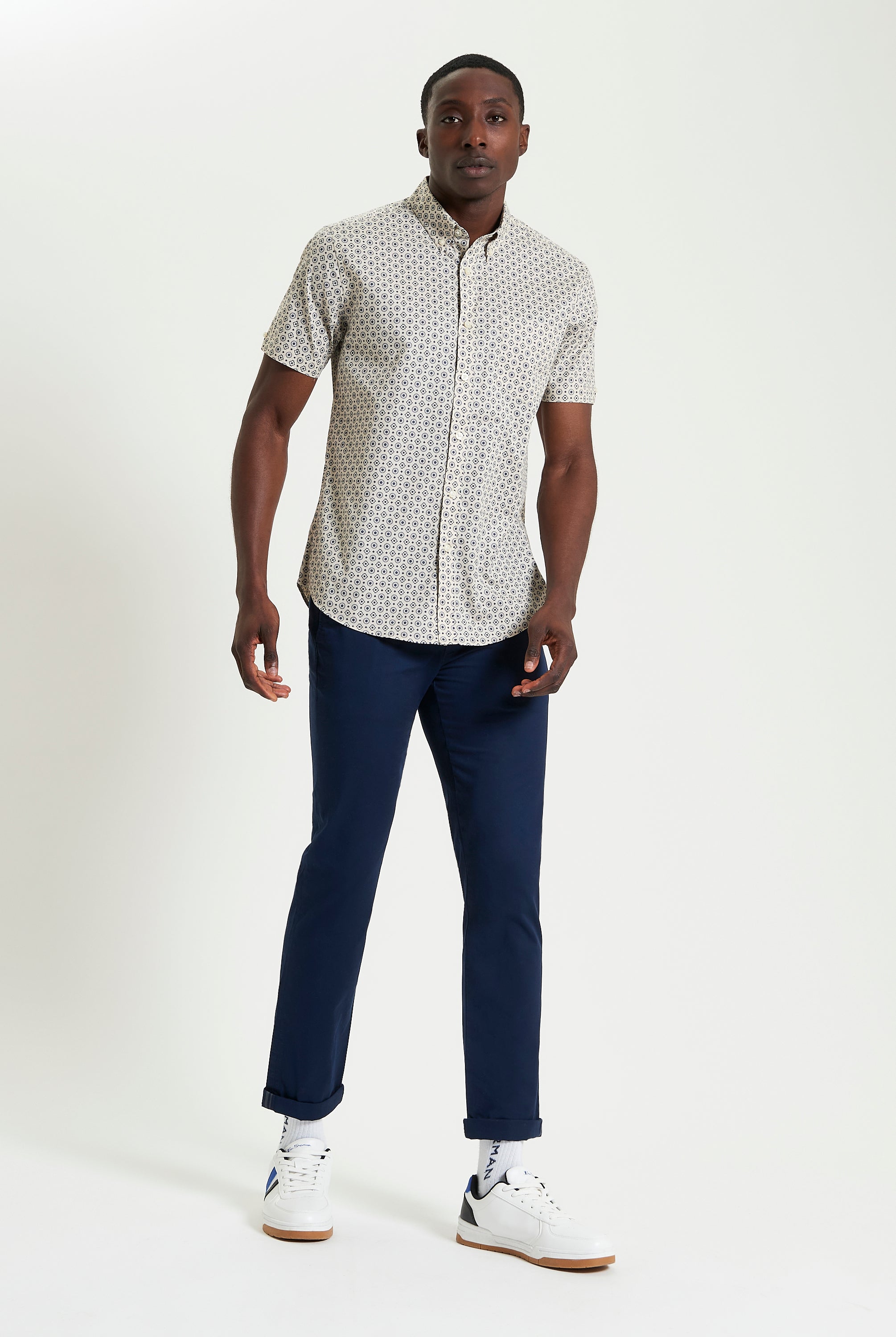Block Geo Print short sleeve shirt styled with navy pants and white sneakers, perfect for casual and smart occasions.