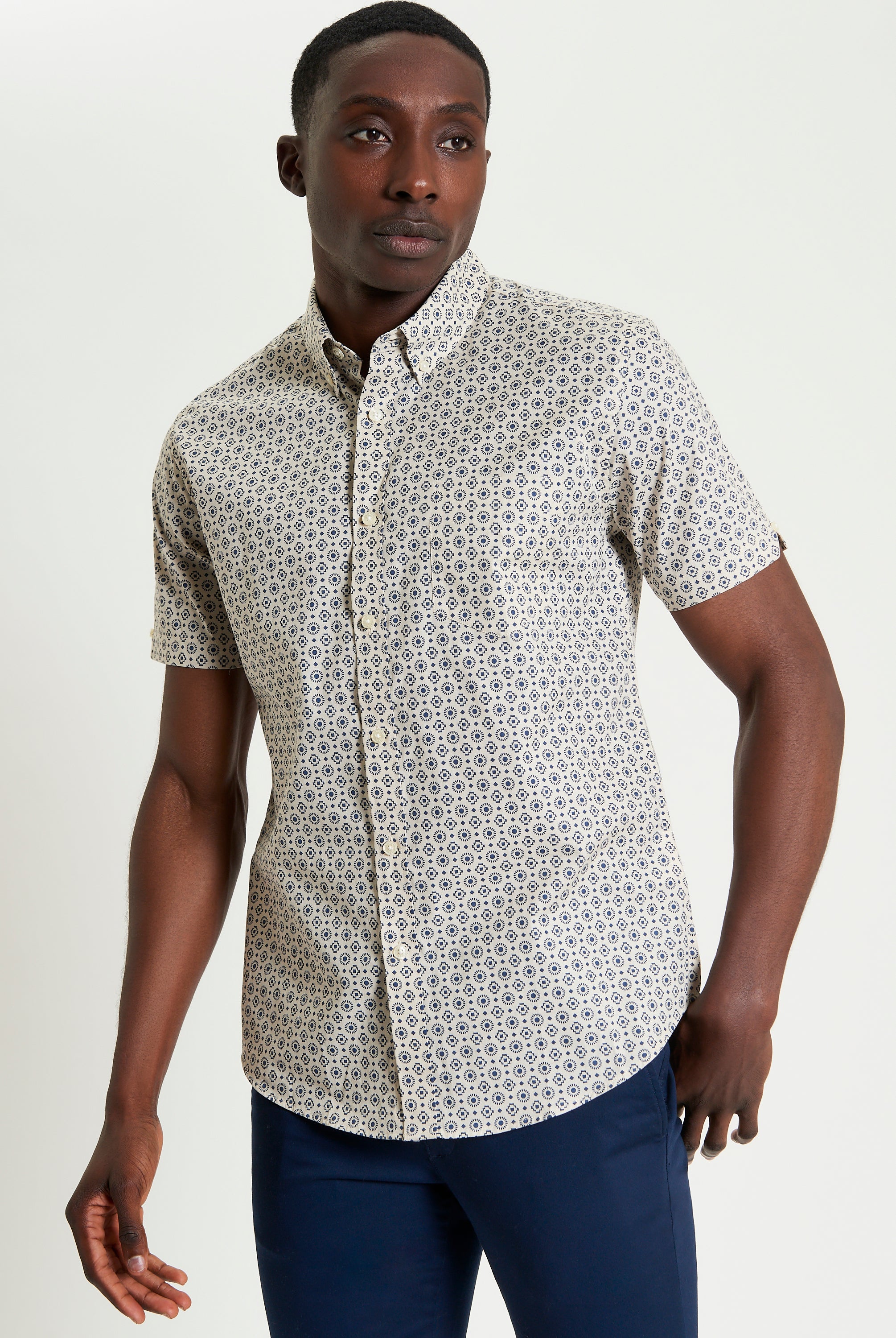 Block Geo Print short sleeve shirt on model, featuring a unique graphic pattern and button-down collar.