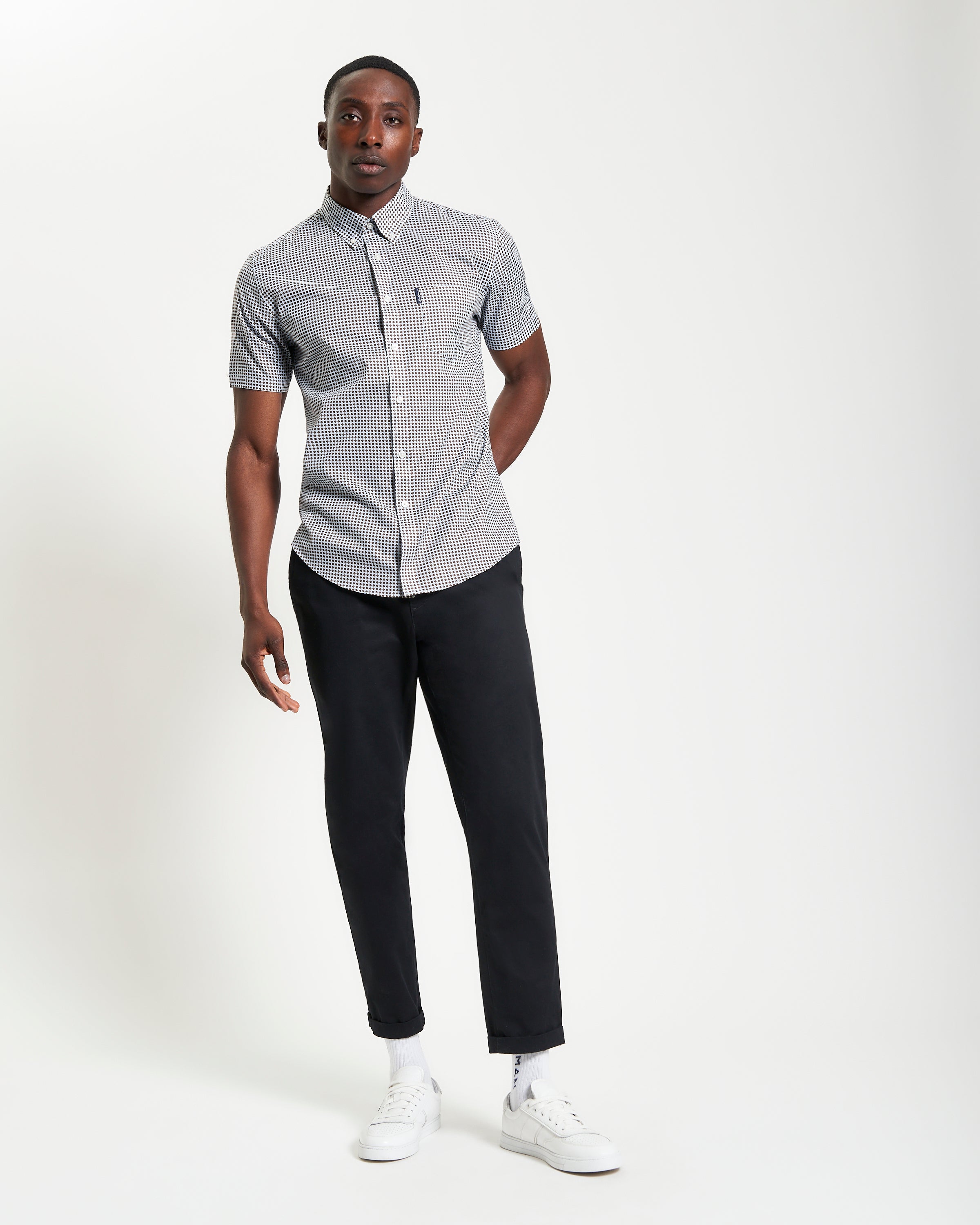 Geo Print shirt worn by model, showcasing modern tailoring with a two-finger collar and Ben Sherman pocket.