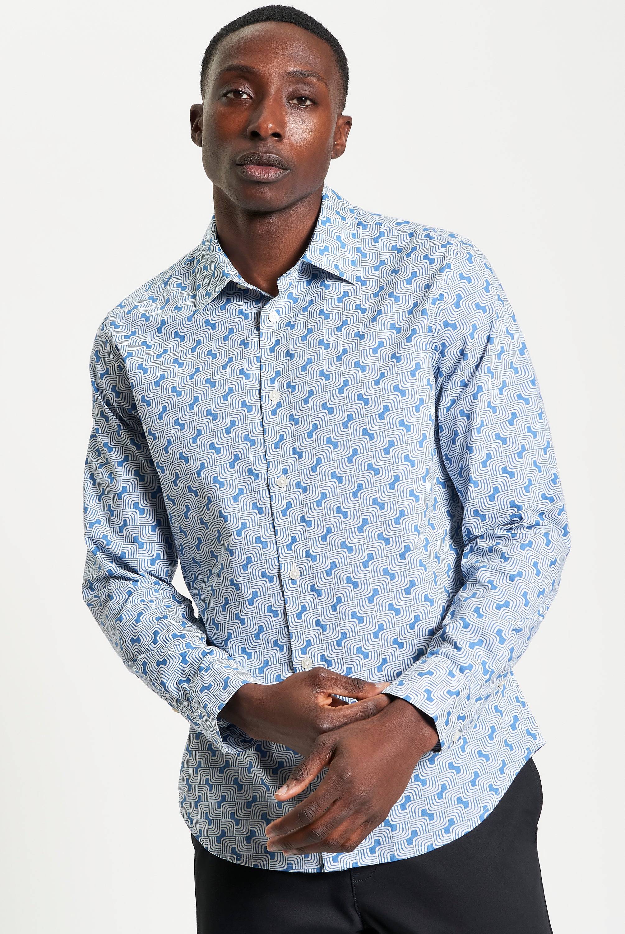 Linear Print – Blue shirt featuring a casual point collar and curved hem for versatile style.