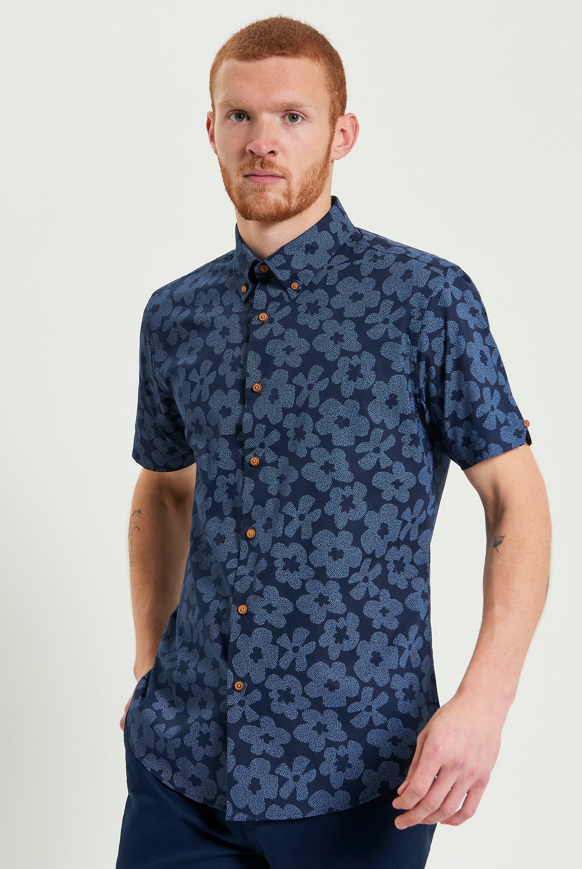 Stipple Floral Print – navy floral shirt with button-down collar and short sleeves, crafted from organic cotton.