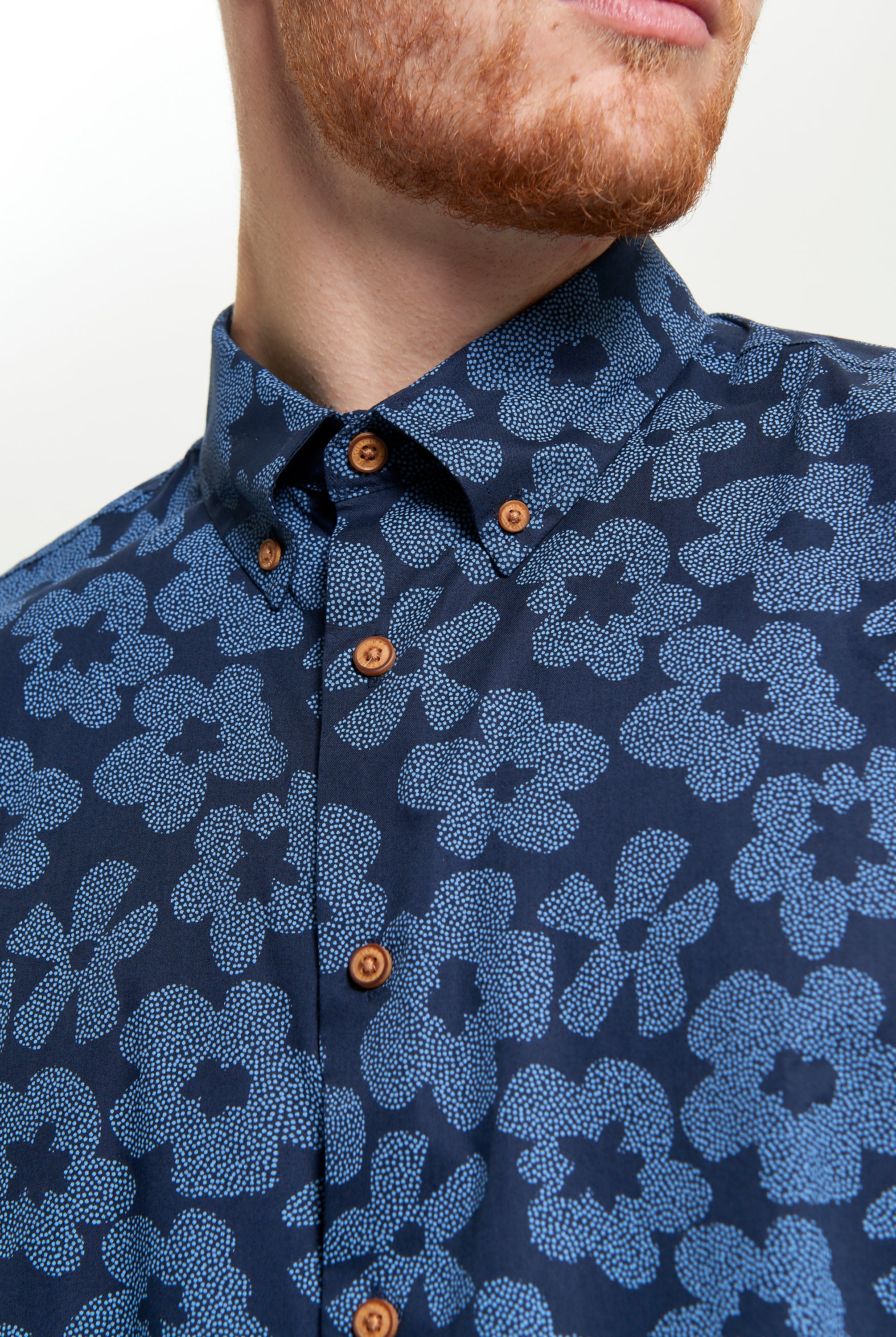 Stipple Floral Print shirt featuring a navy blue floral design and button-down collar for smart-casual style.