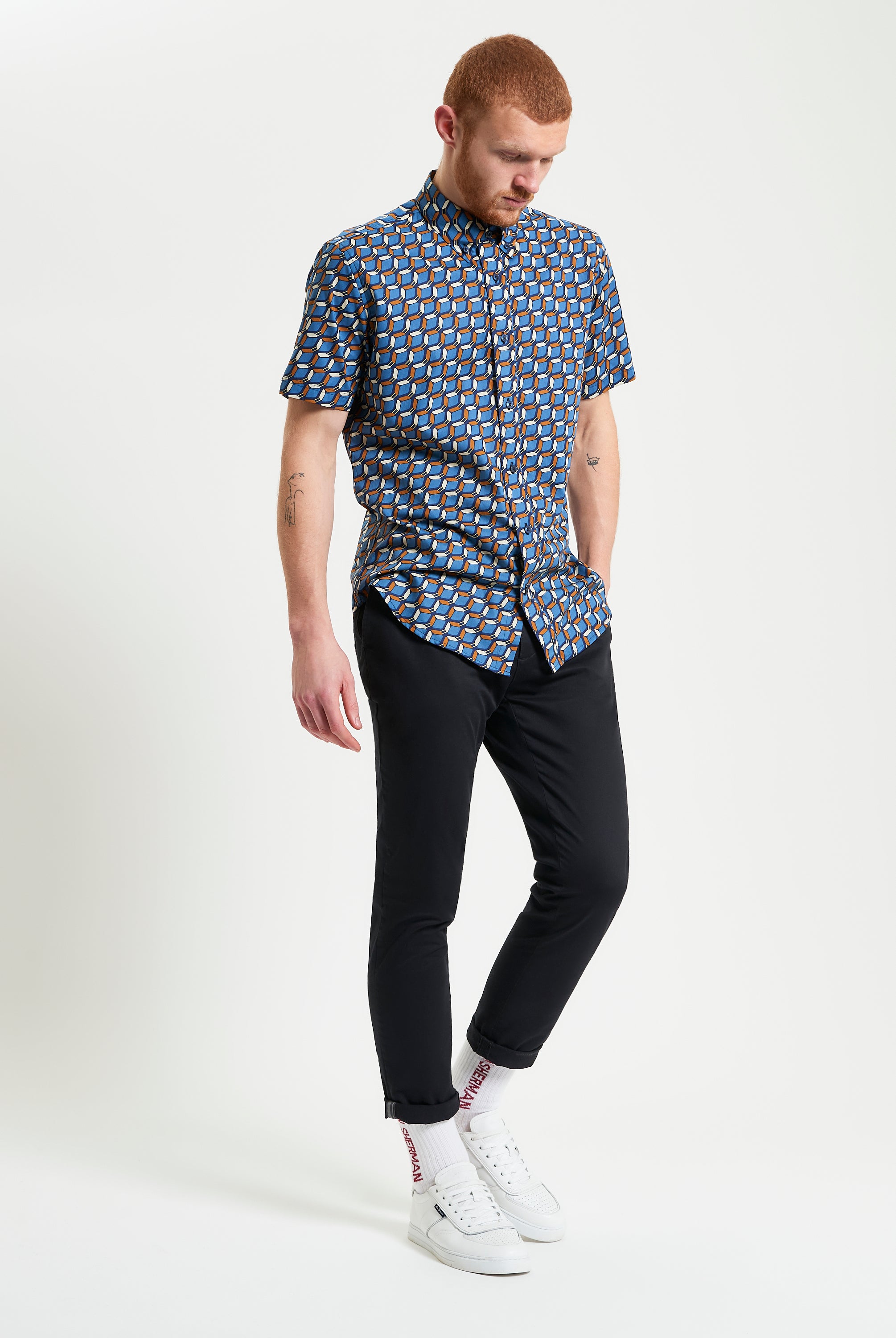 Retro Geo Print shirt worn by a model, showcasing vintage design and bold geo print on organic cotton.