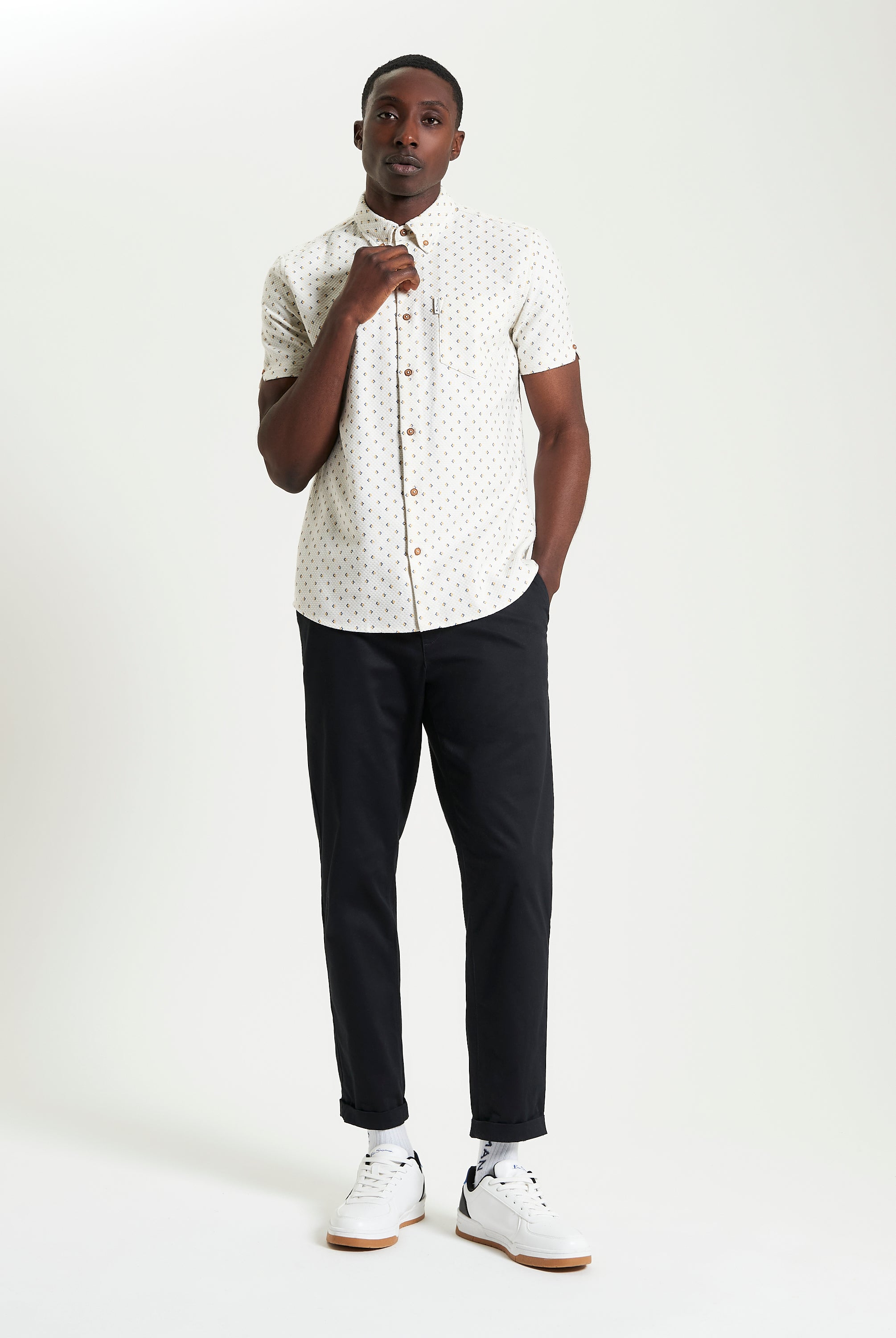 Split Geo Print short-sleeve shirt from Ben Sherman on a model, featuring a two-finger button-down collar.