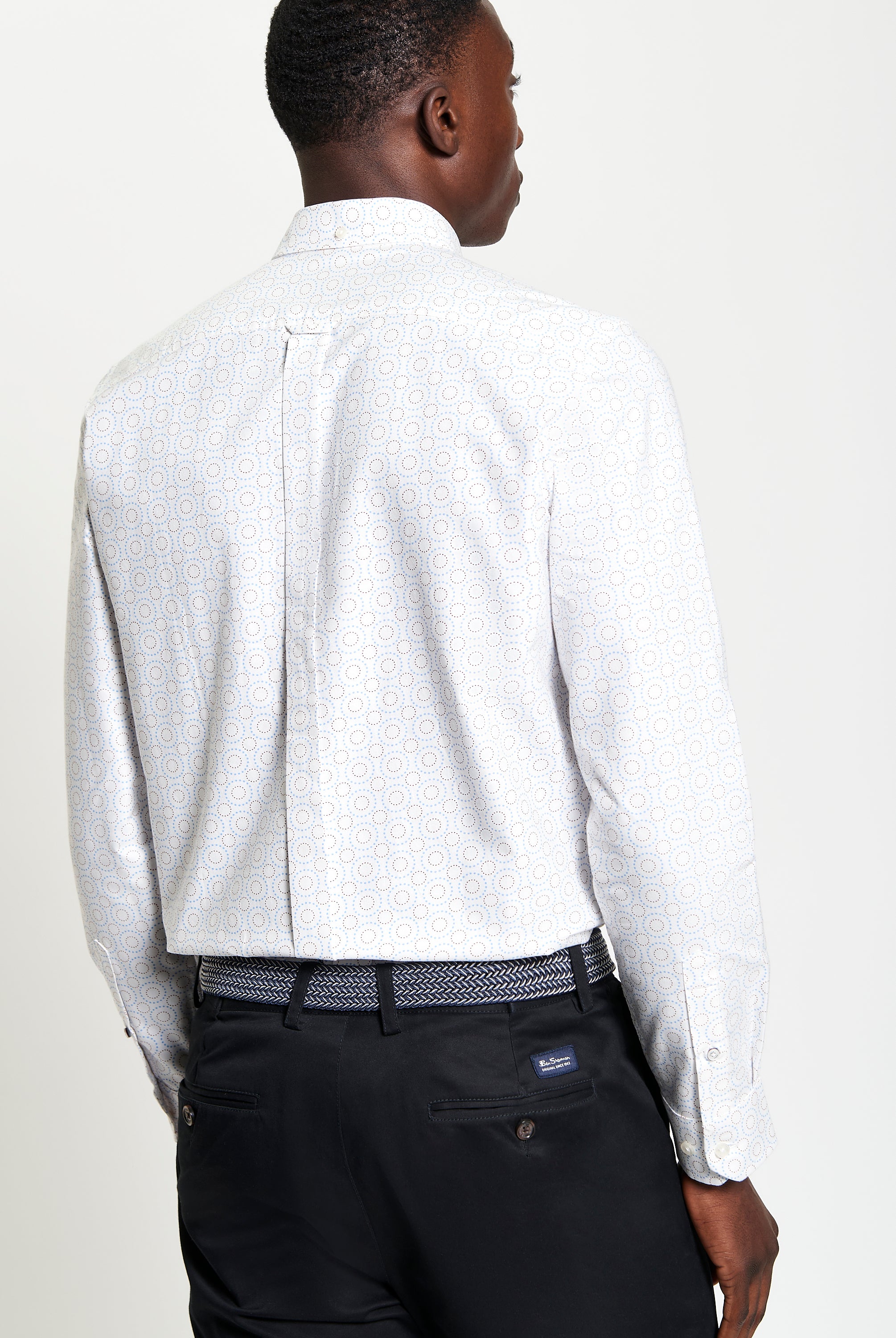 Stipple Spot Print – long sleeve shirt showcasing modern fit and curved hem, features playful print and classic button-down collar.