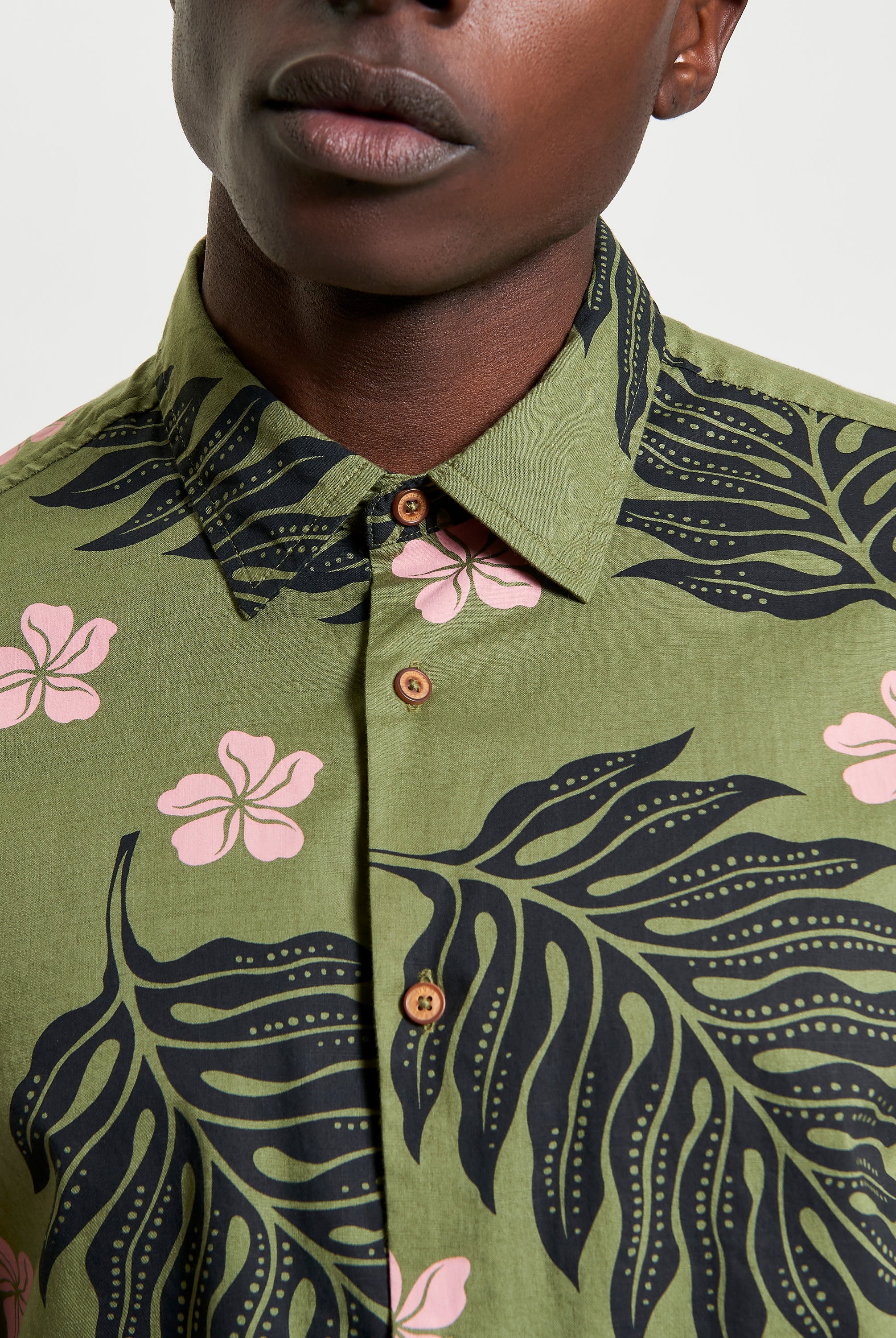 Botanical Print Shirt featuring bold floral and leaf patterns, perfect for summer styling and casual occasions.