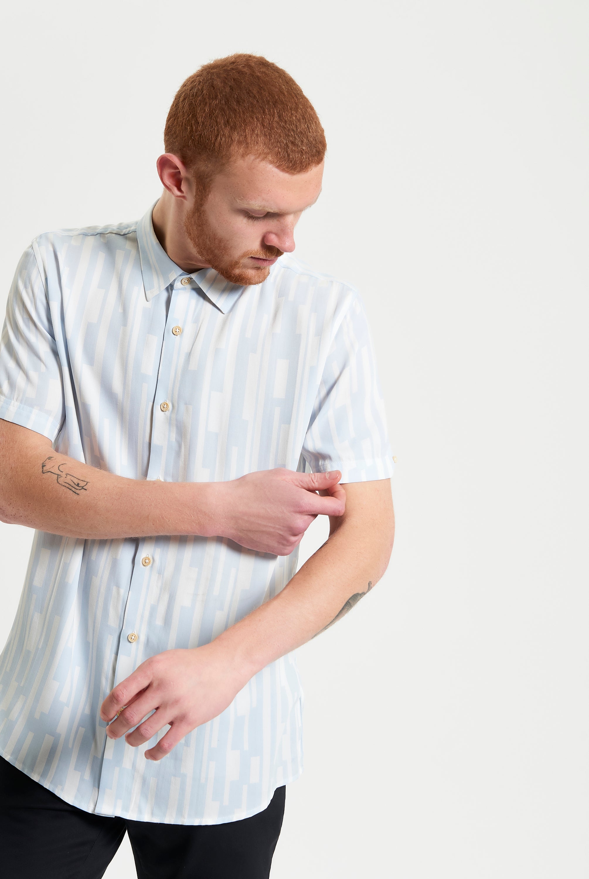 Jazz Lines Print shirt with a light blue geometric pattern, showcasing breathable design and button-down collar style.