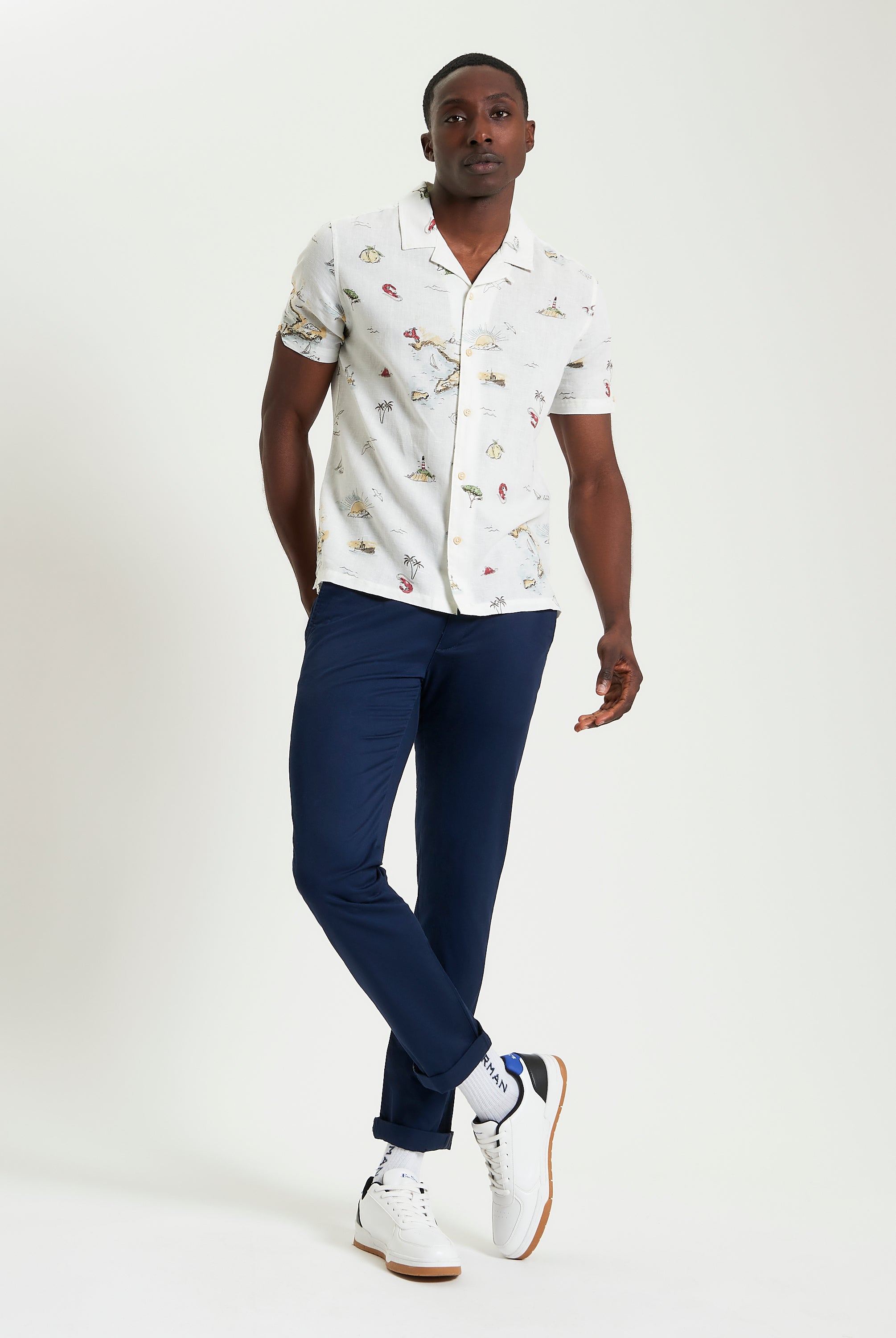 Brighton To Amalfi Print short-sleeve shirt worn by a man, featuring a coastal design and relaxed fit.