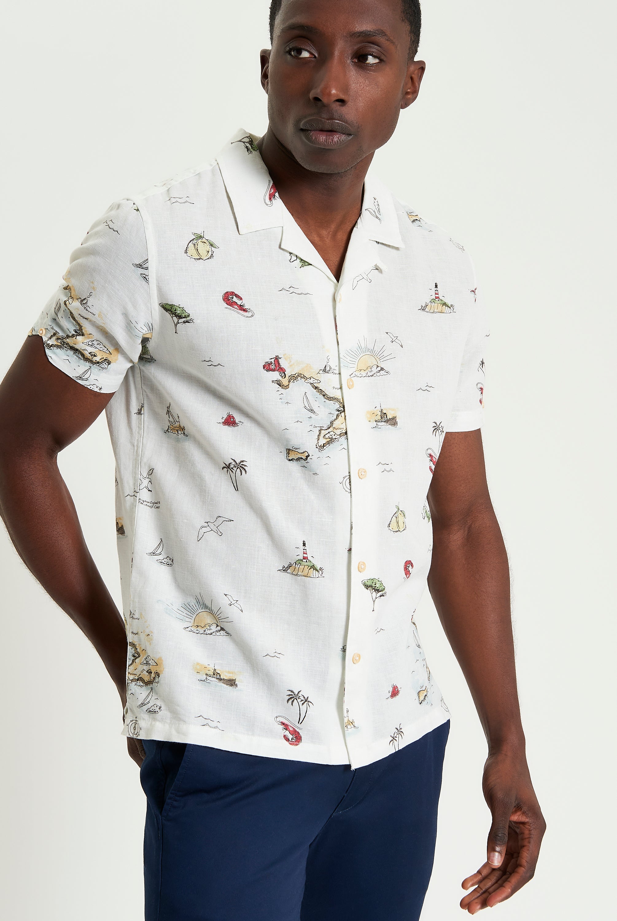 Brighton To Amalfi Print short-sleeve shirt featuring coastal scenes, relaxed fit and open collar for tropical vibes.