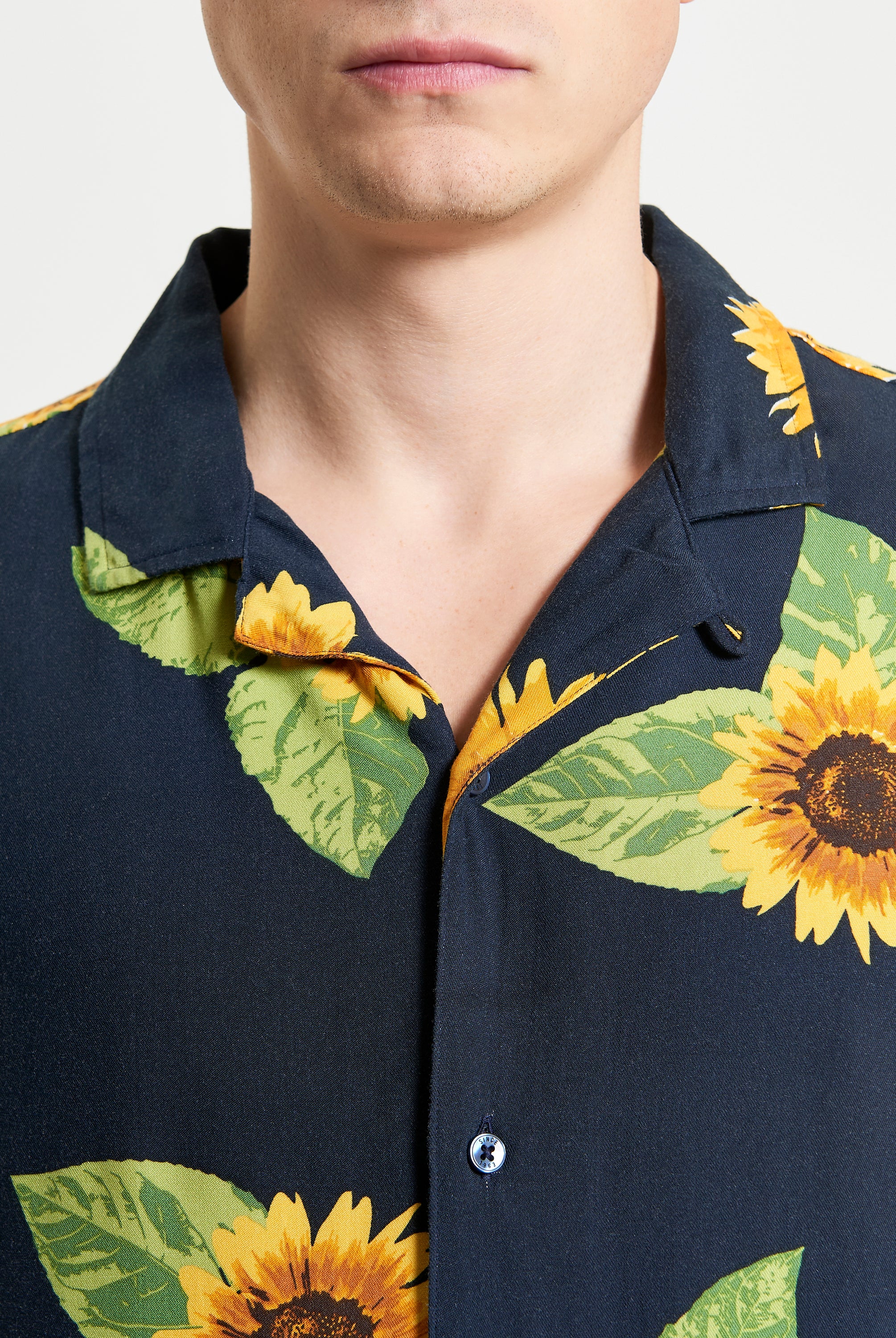 Sunflower Print – Front view of relaxed fit shirt featuring vibrant sunflower design and open collar.