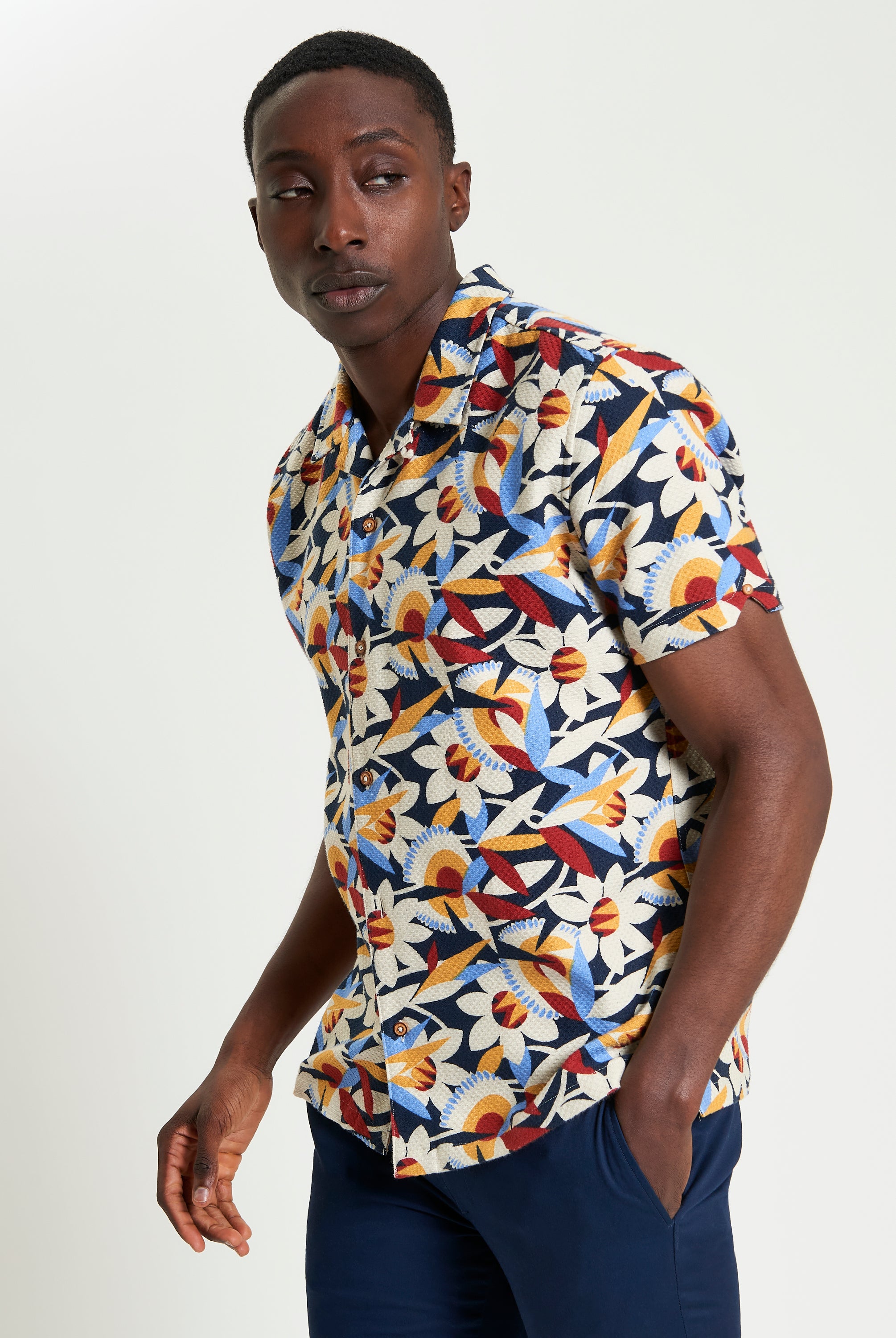 Abstract Floral Print – Short-sleeve shirt featuring vibrant floral pattern and revere collar for stylish comfort.