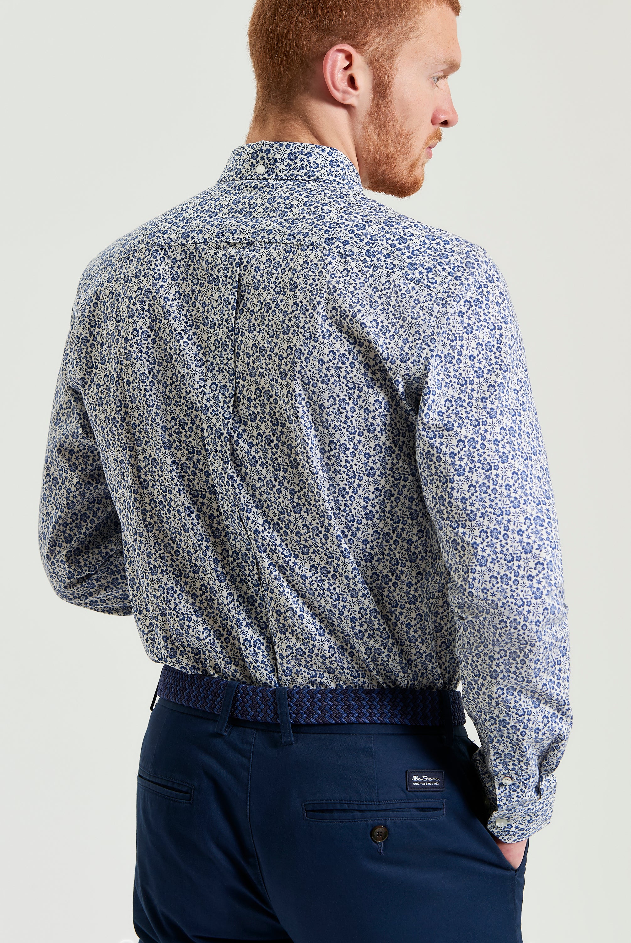 Mono Floral Print – back view of a man wearing a long-sleeve shirt in a subtle floral design.