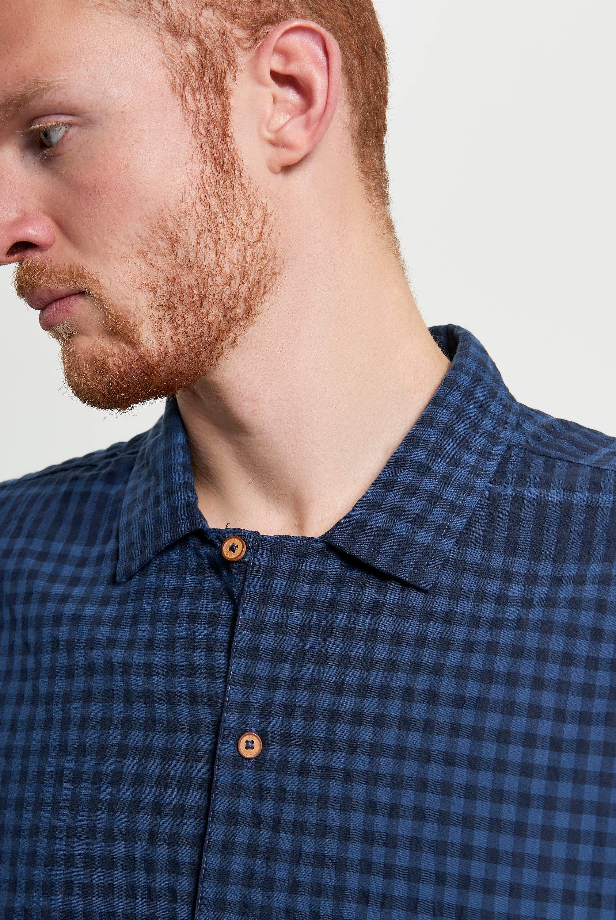 Seersucker Gingham short sleeve shirt featuring a relaxed fit and revere collar, perfect for warm days.
