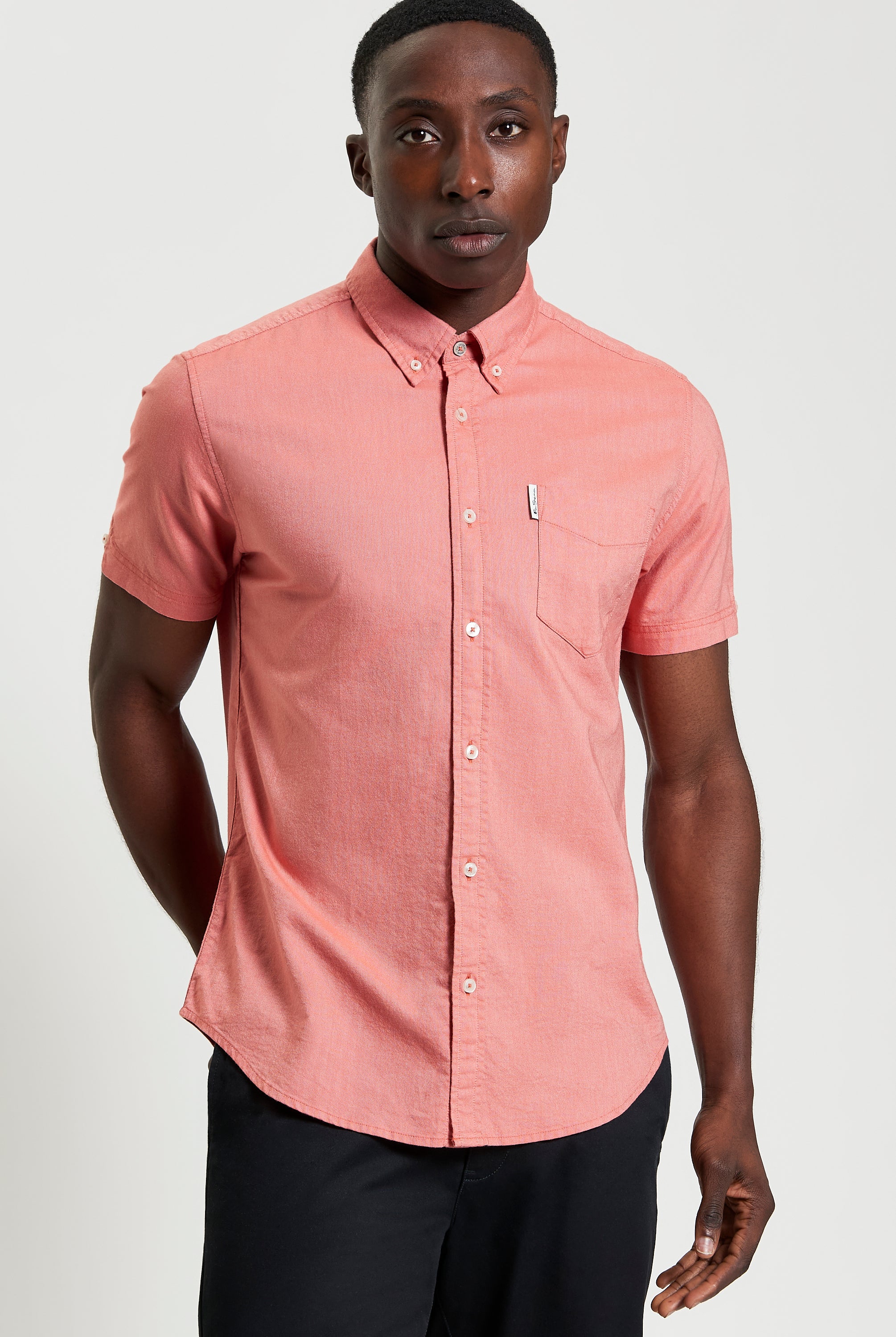 Signature Oxford Short Sleeve Shirt – coral with button-down collar and chest pocket.