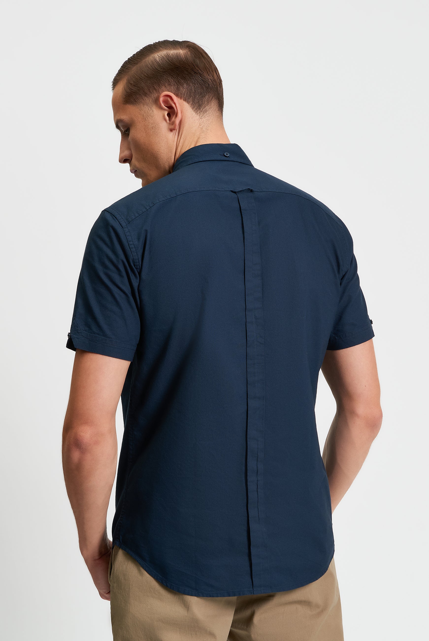 Signature Oxford Short Sleeve Shirt β Back view showcasing the minimalist design and organic cotton fabric.