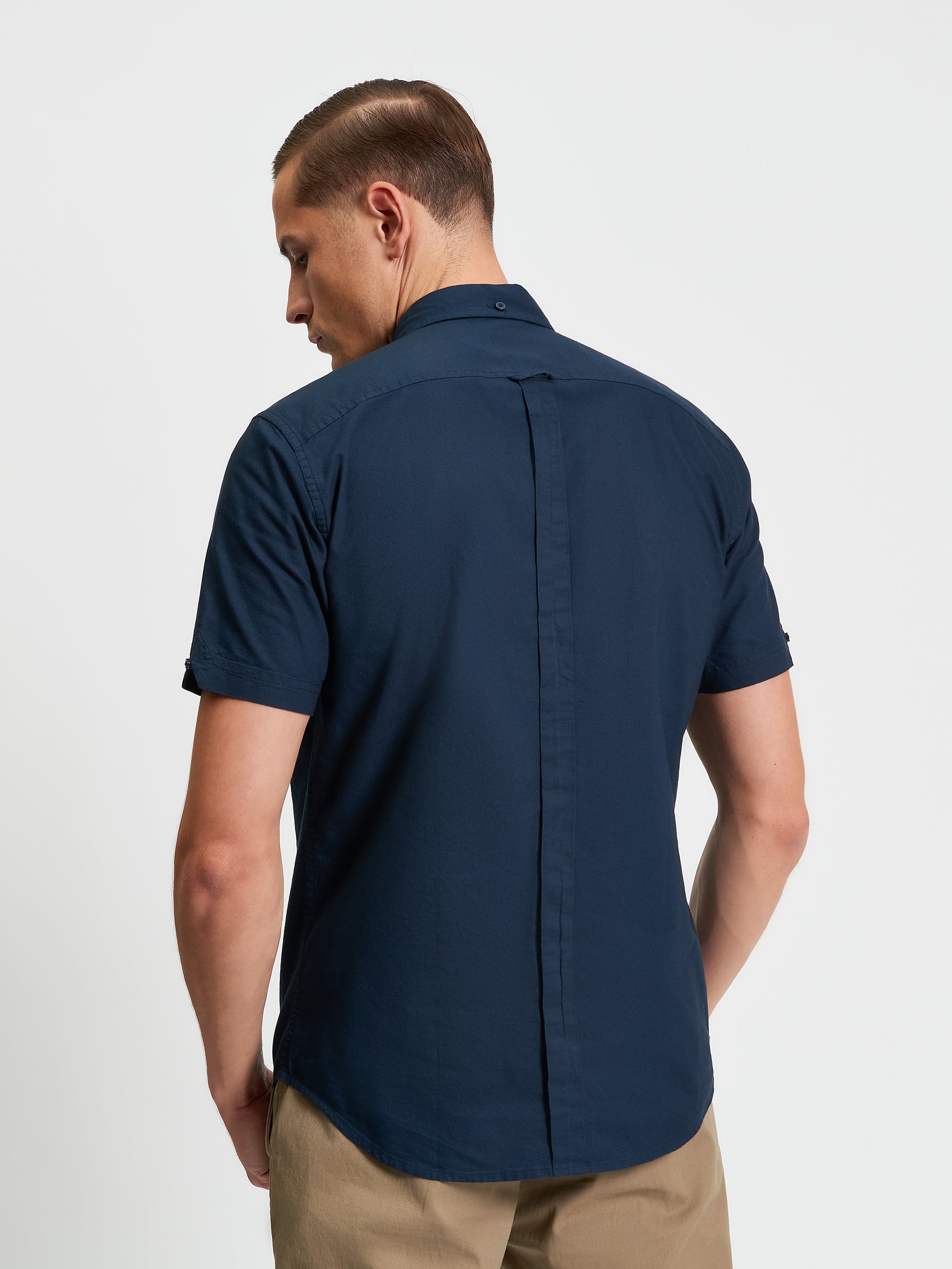 Signature Oxford Short Sleeve Shirt – Back view showcasing the minimalist design and organic cotton fabric.