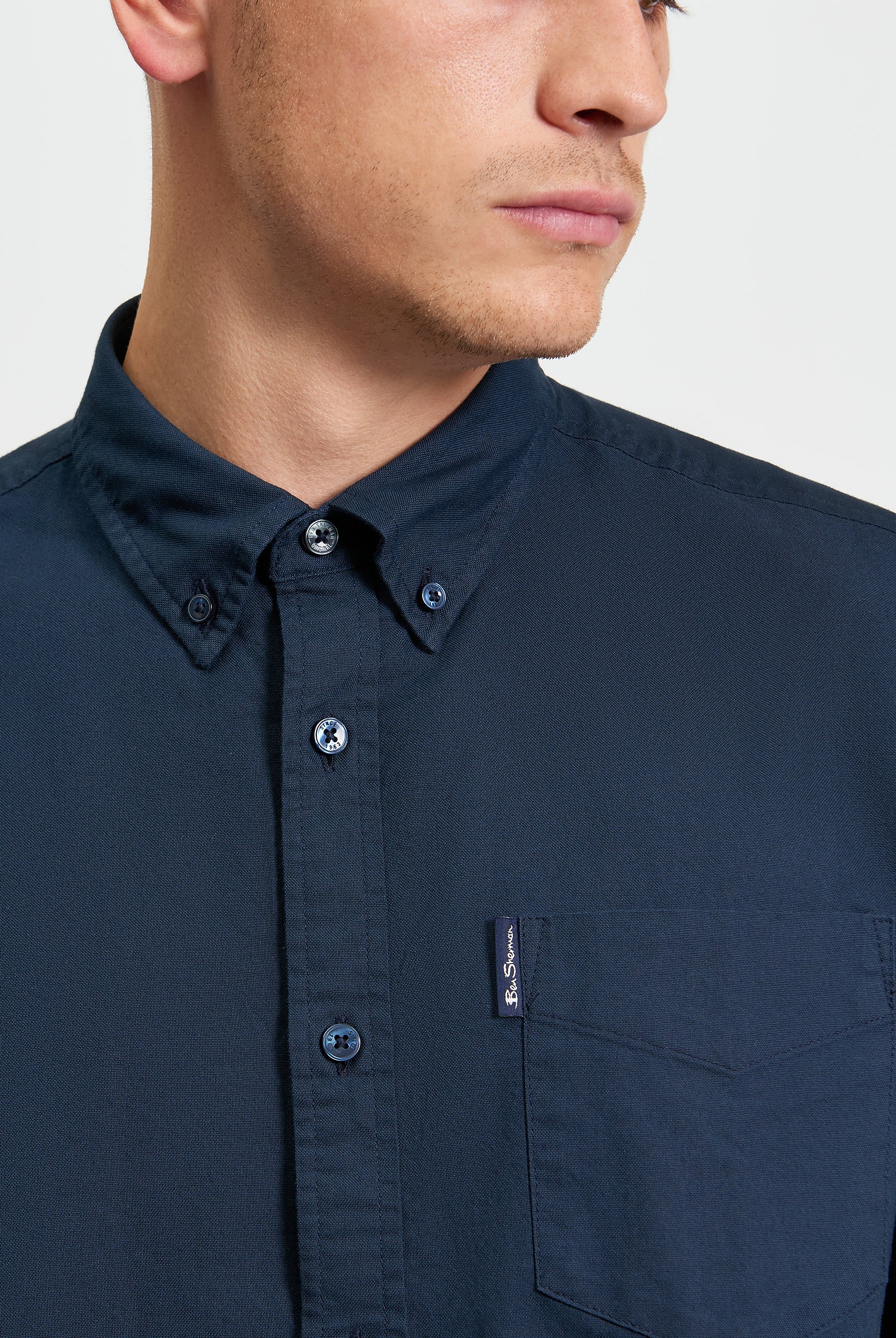 Signature Oxford Short Sleeve Shirt β Navy β featuring a button-down collar and chest pocket with woven label.