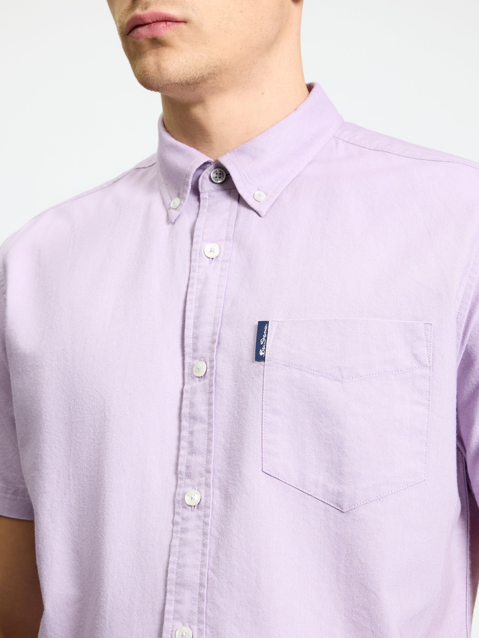 Signature Oxford Short Sleeve Shirt – light purple color with button-down collar and chest pocket detail.