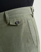 Linen Cotton Trouser – olive green close-up of waistband and pockets, showcasing slim fit and sleek design.