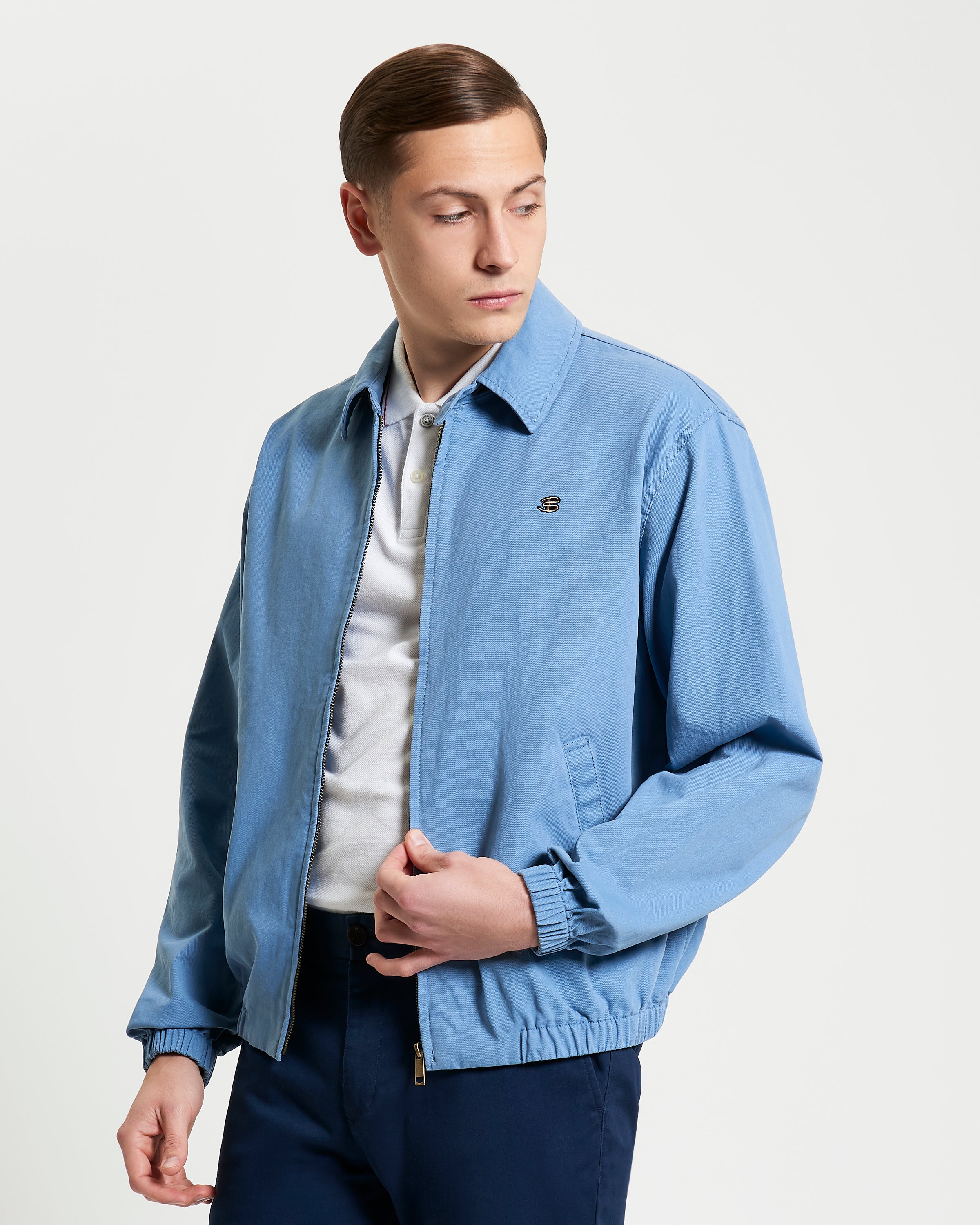 Sports Blouson – light blue jacket with full zip, elasticated hem and cuffs, featuring chest embroidery and comfortable fit.
