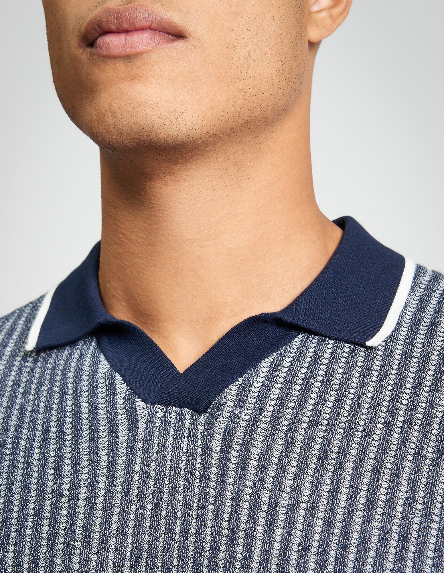 Bi Coloured Textured Polo β close-up of the collar and neckline pattern in navy and white.
