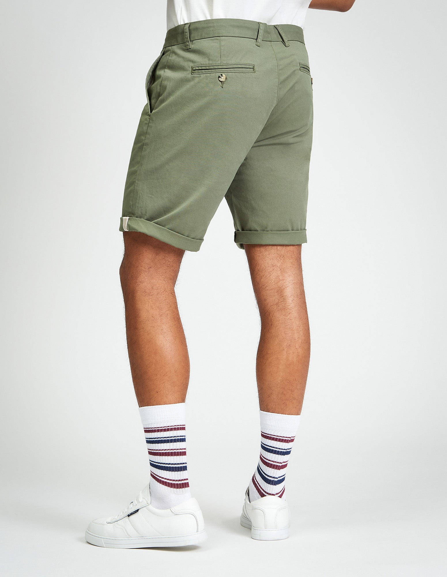 Signature Chino Short – olive green, showcasing clean tailoring and signature detailing at the hem.