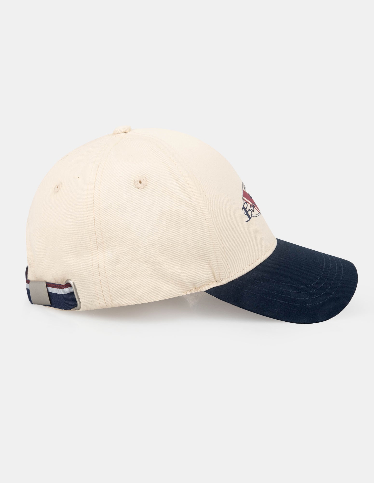CONTRAST PEAK HAT - beige and navy cap with logo, side view.