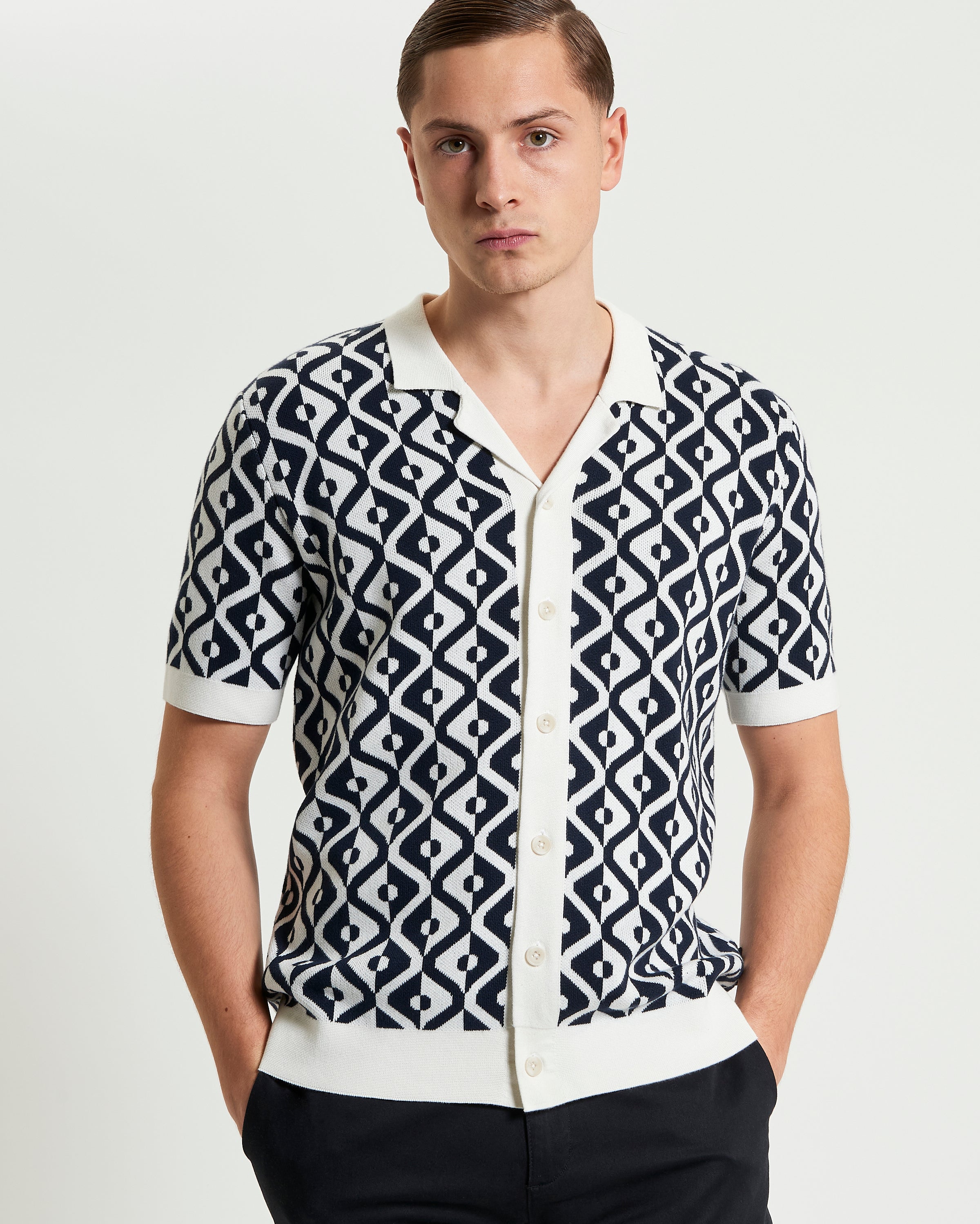 Tile Resort Knitted Shirt on model, featuring a striking tile jacquard knit and relaxed revere collar.