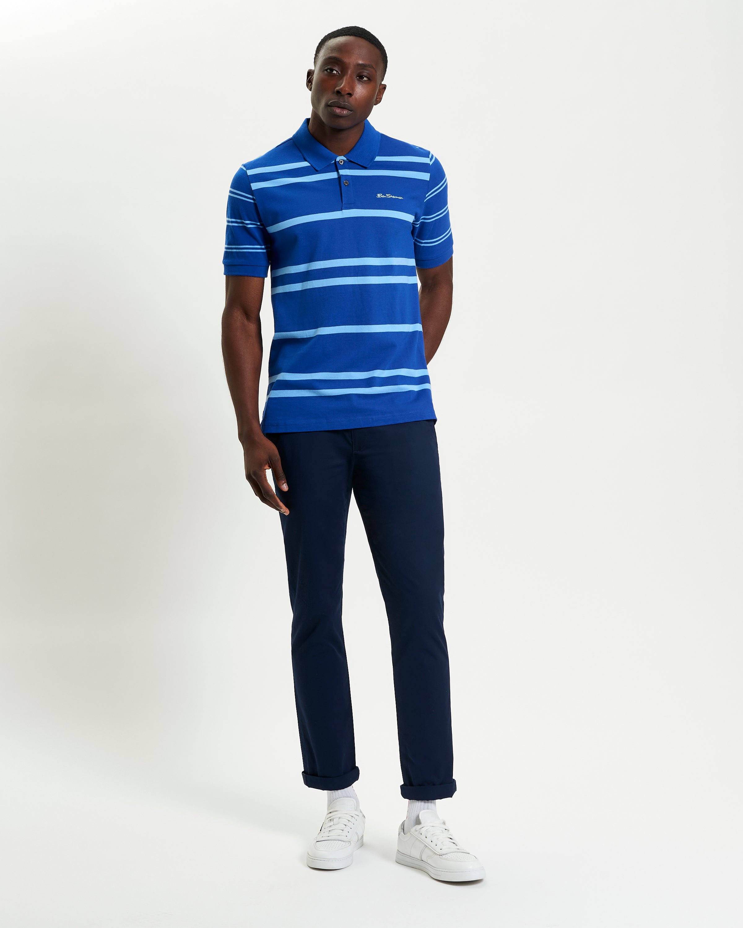 Mixed Stripe Polo – blue and white striped shirt featuring a relaxed fit and two button placket.