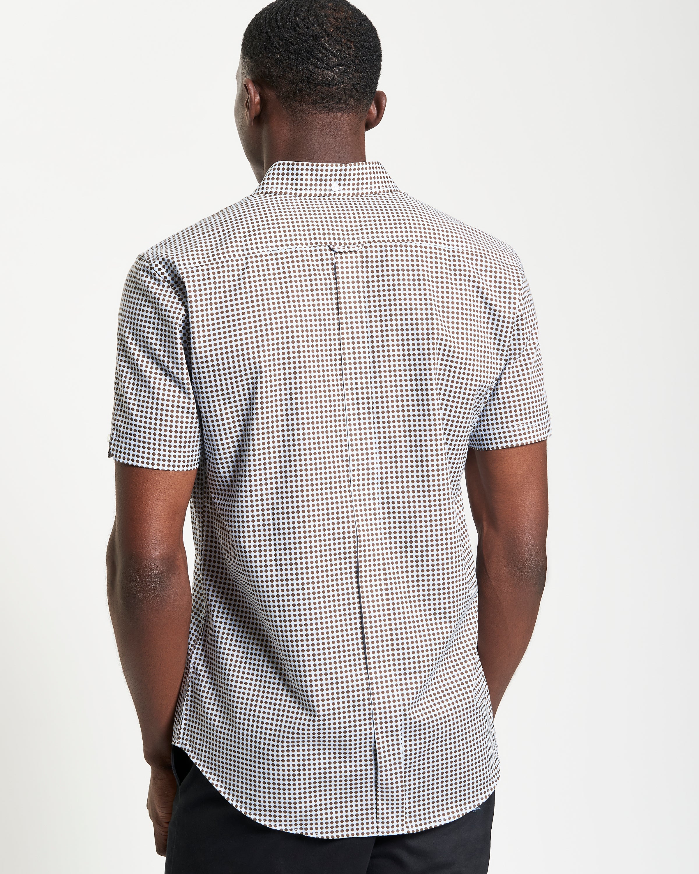 Geo Print shirt – back view, showcasing the curved hem and smooth tailoring.