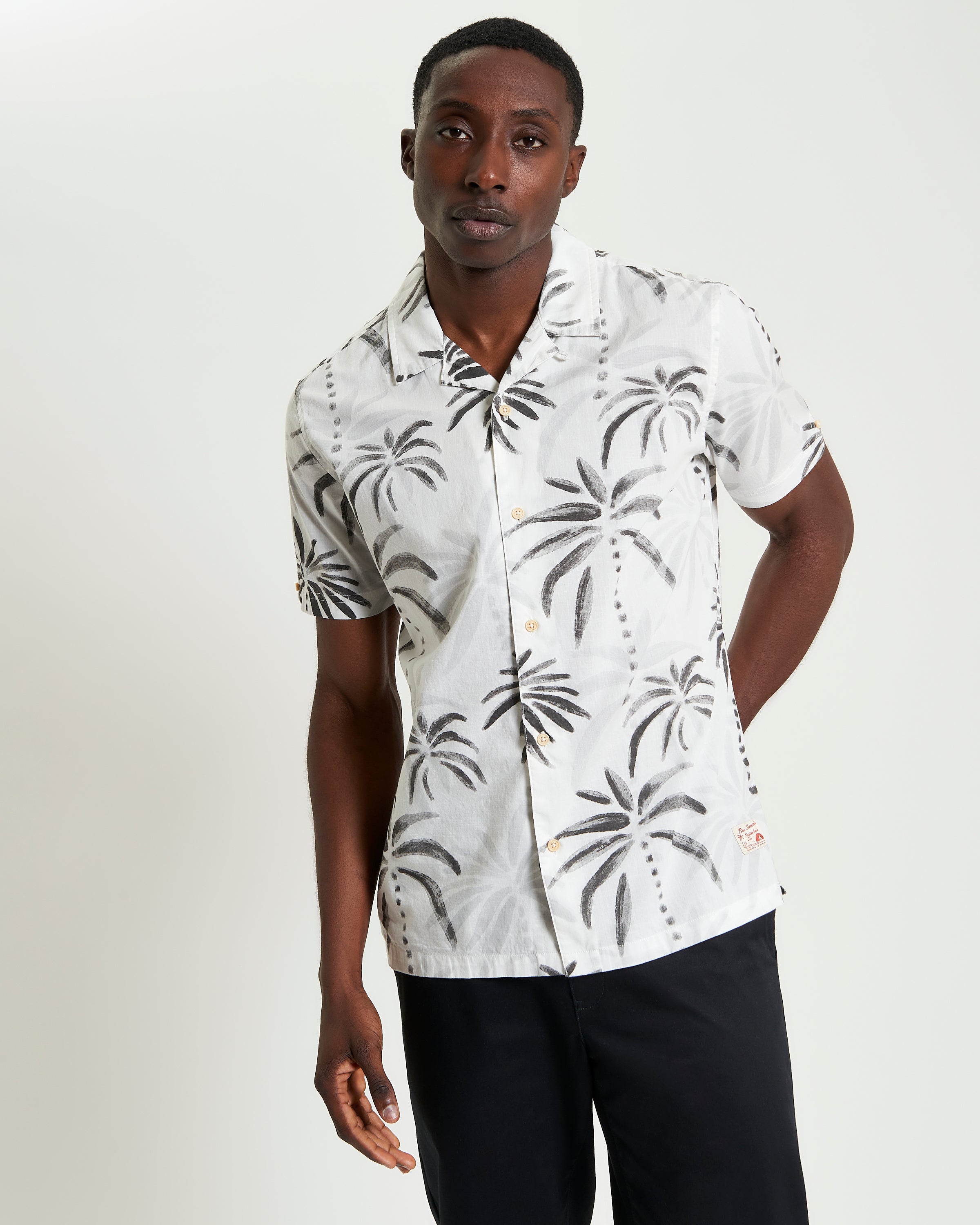 Palm Print Shirt – Short sleeves and relaxed fit with palm tree design for a tropical summer style.