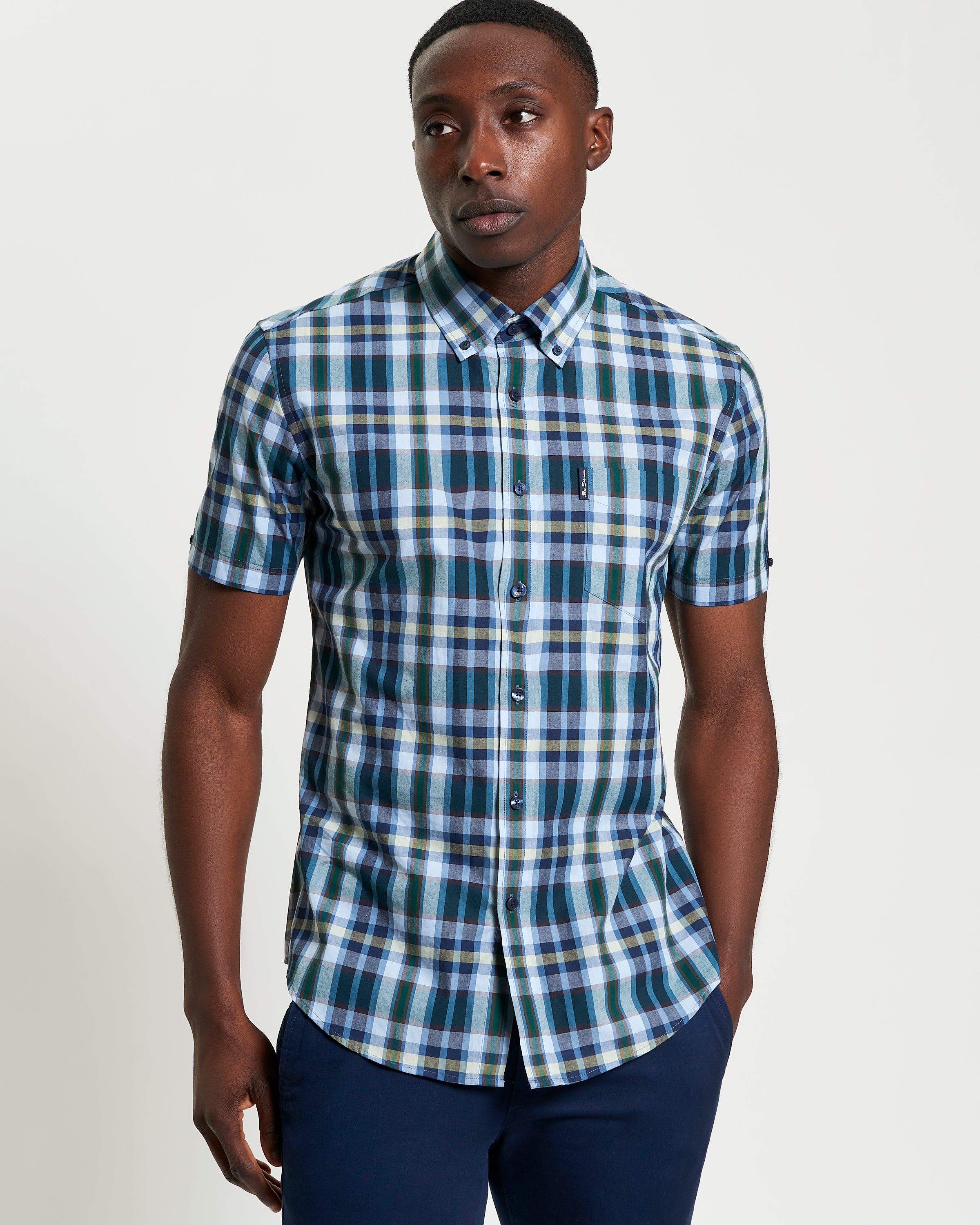 Irregular Check shirt worn by a model, featuring a modern plaid pattern on organic cotton.