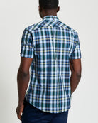 Irregular Check shirt – back view showcasing modern check pattern and curved hem design.