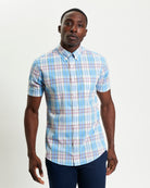 Irregular Check shirt in blue and pastel colors – short sleeve regular fit with button-down collar and curved hem.