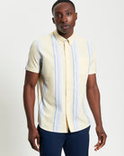 Oxford Stripe – short sleeve shirt with yellow and blue stripes, featuring a button-down collar and chest pocket.