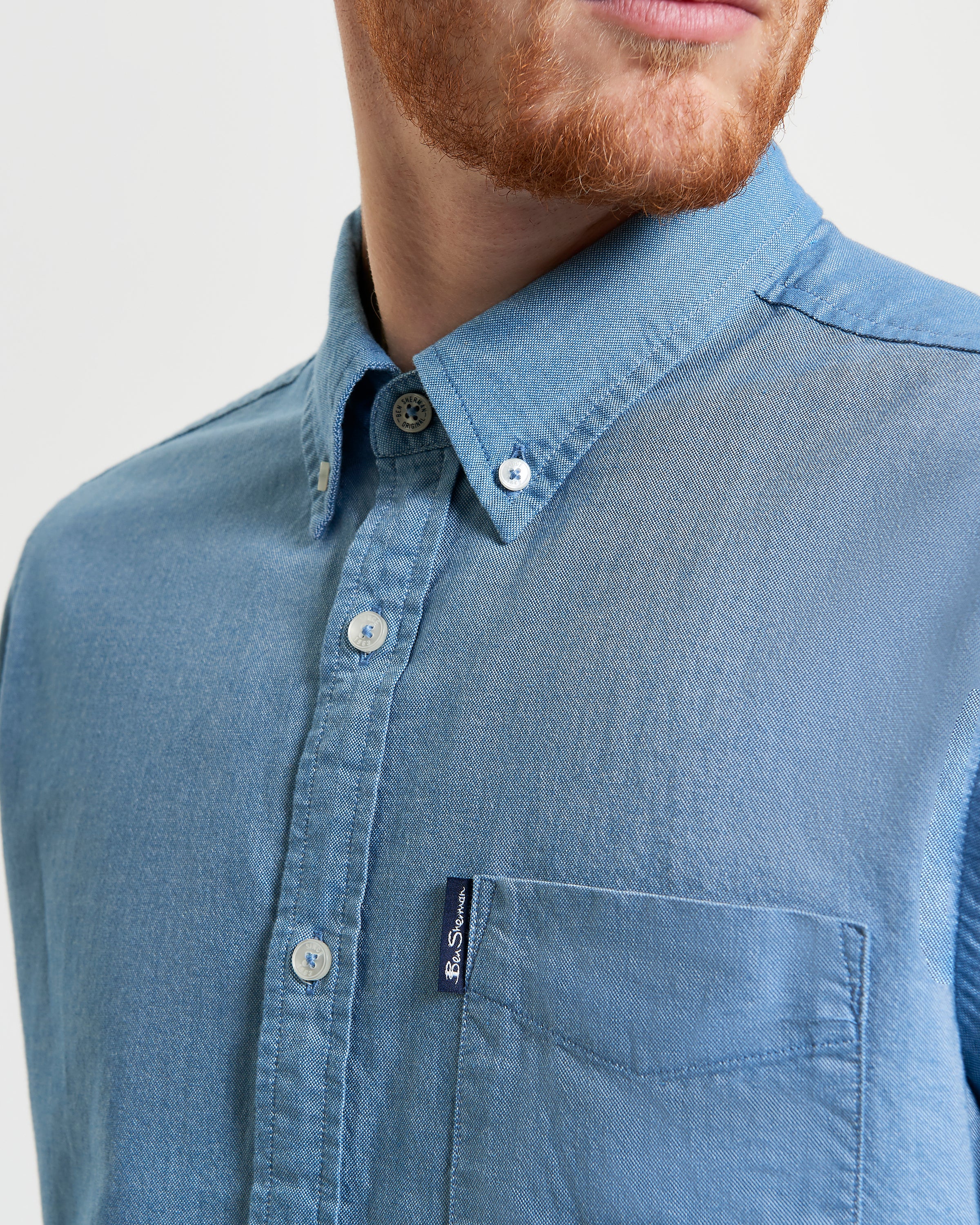 Signature Oxford Short Sleeve Shirt – Blue – featuring a button-down collar and chest pocket with woven label.