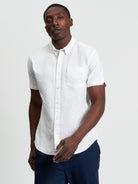 Signature Oxford Short Sleeve Shirt – White with short sleeves and chest pocket.