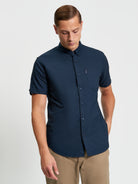 Signature Oxford Short Sleeve Shirt – Navy with short sleeves and chest pocket.