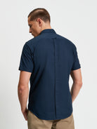 Signature Oxford Short Sleeve Shirt – Back view showcasing the minimalist design and organic cotton fabric.