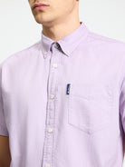 Signature Oxford Short Sleeve Shirt – light purple color with button-down collar and chest pocket detail.