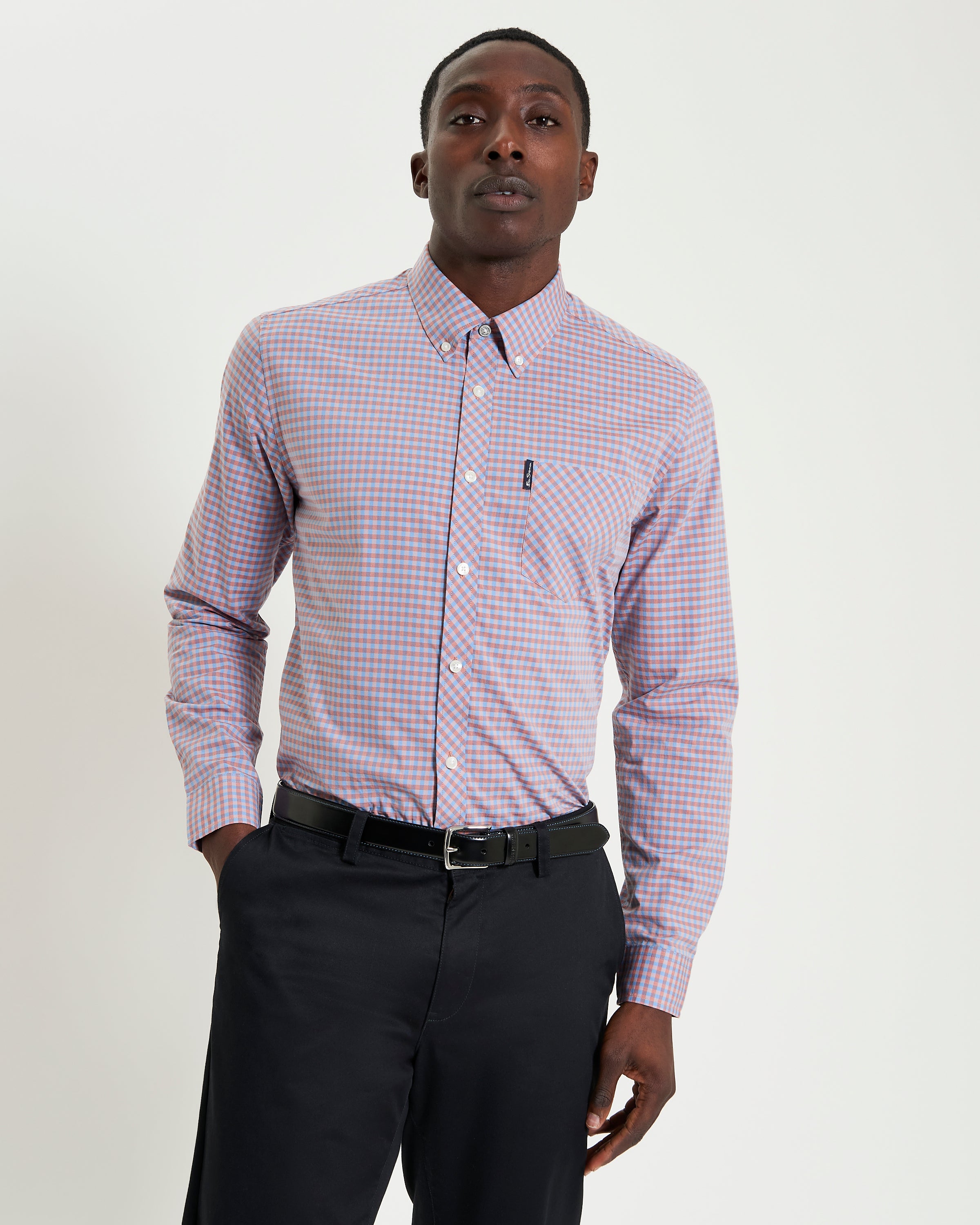 Signature Gingham Long Sleeve Shirt – modern fit with vibrant checks and classic details, worn with black trousers.