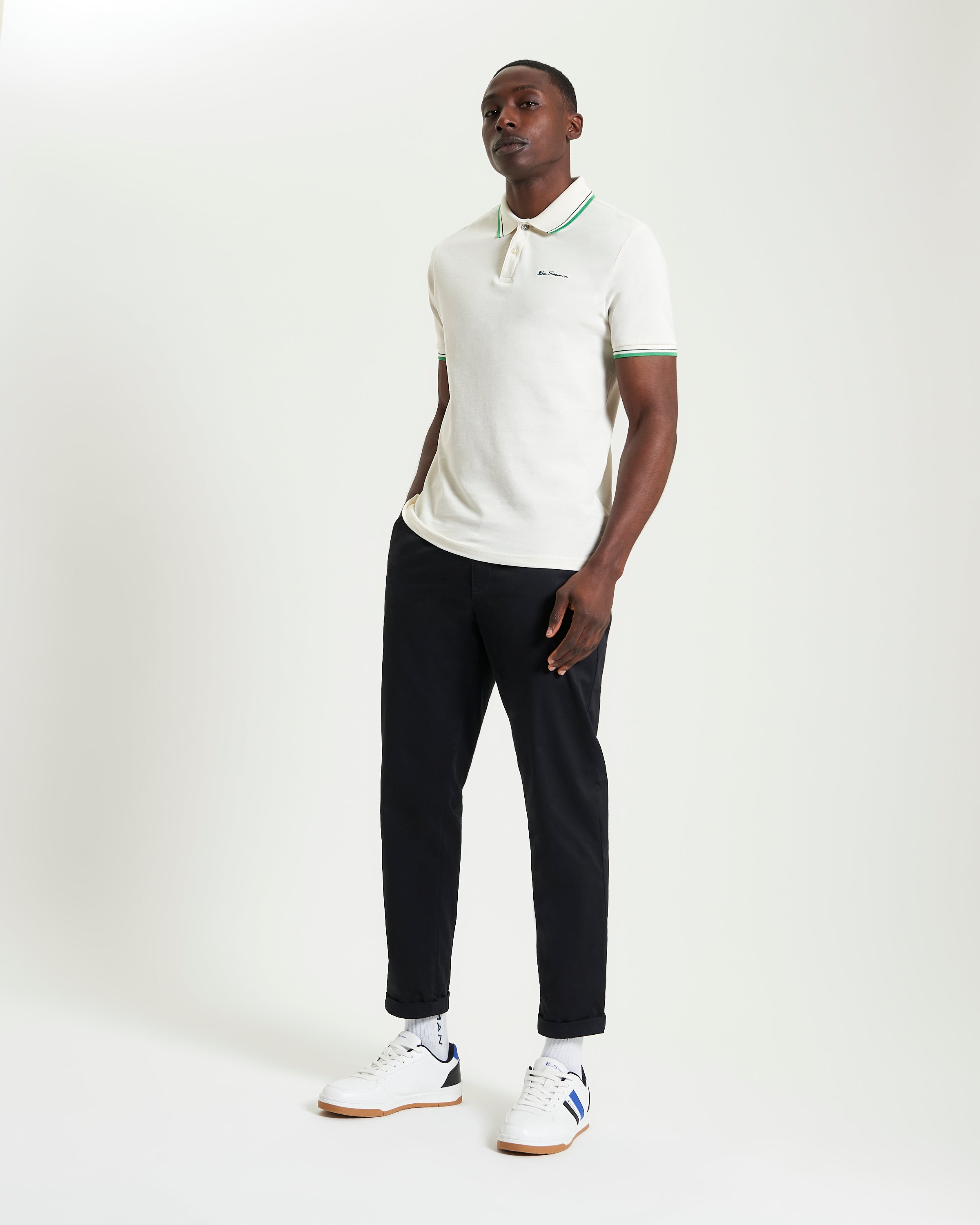 Signature Pique Polo – Casual style featuring a model in a polo shirt with contrast detailing.
