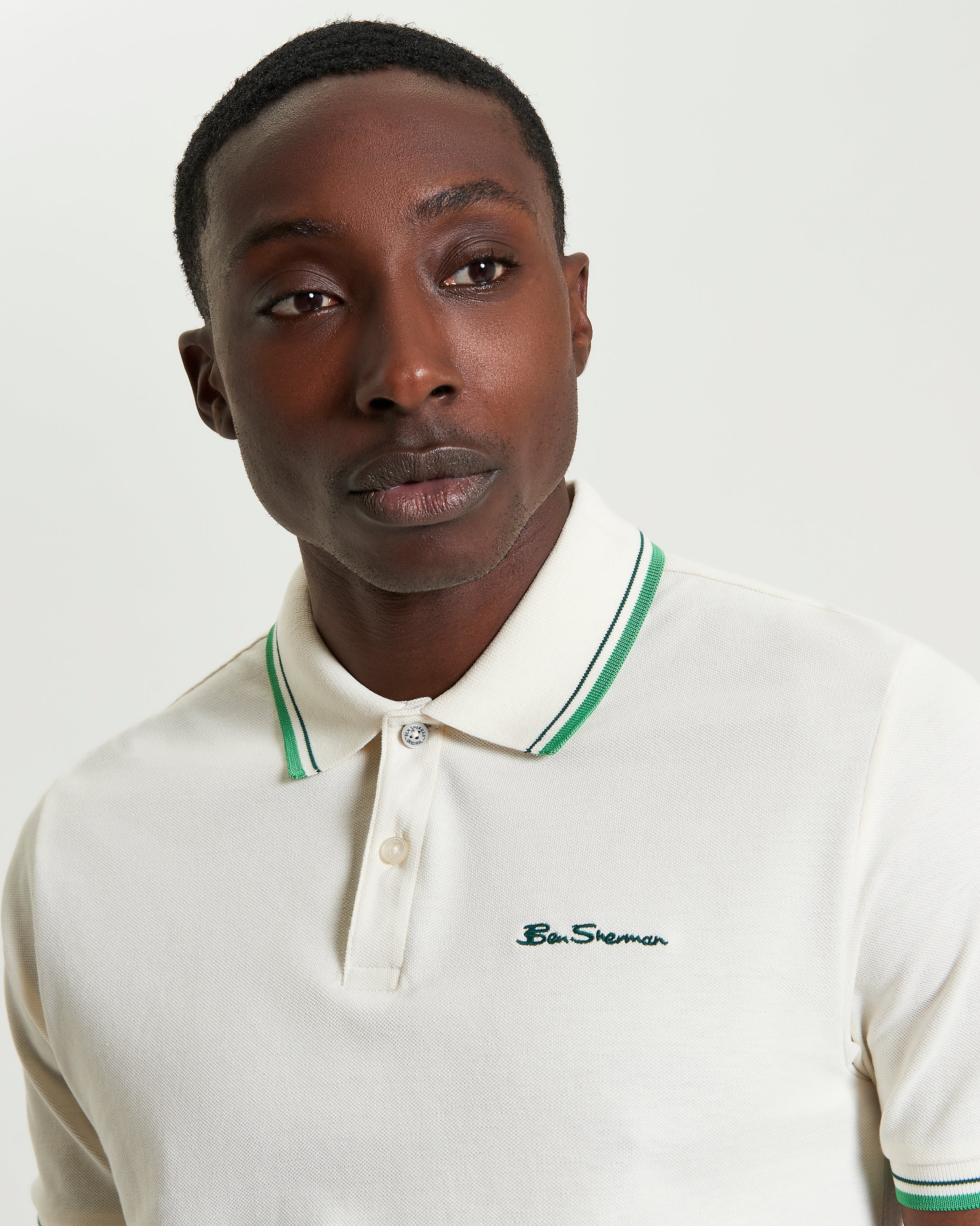 Signature Pique Polo – Cream with Green Contrast Detailing, Model Close-up