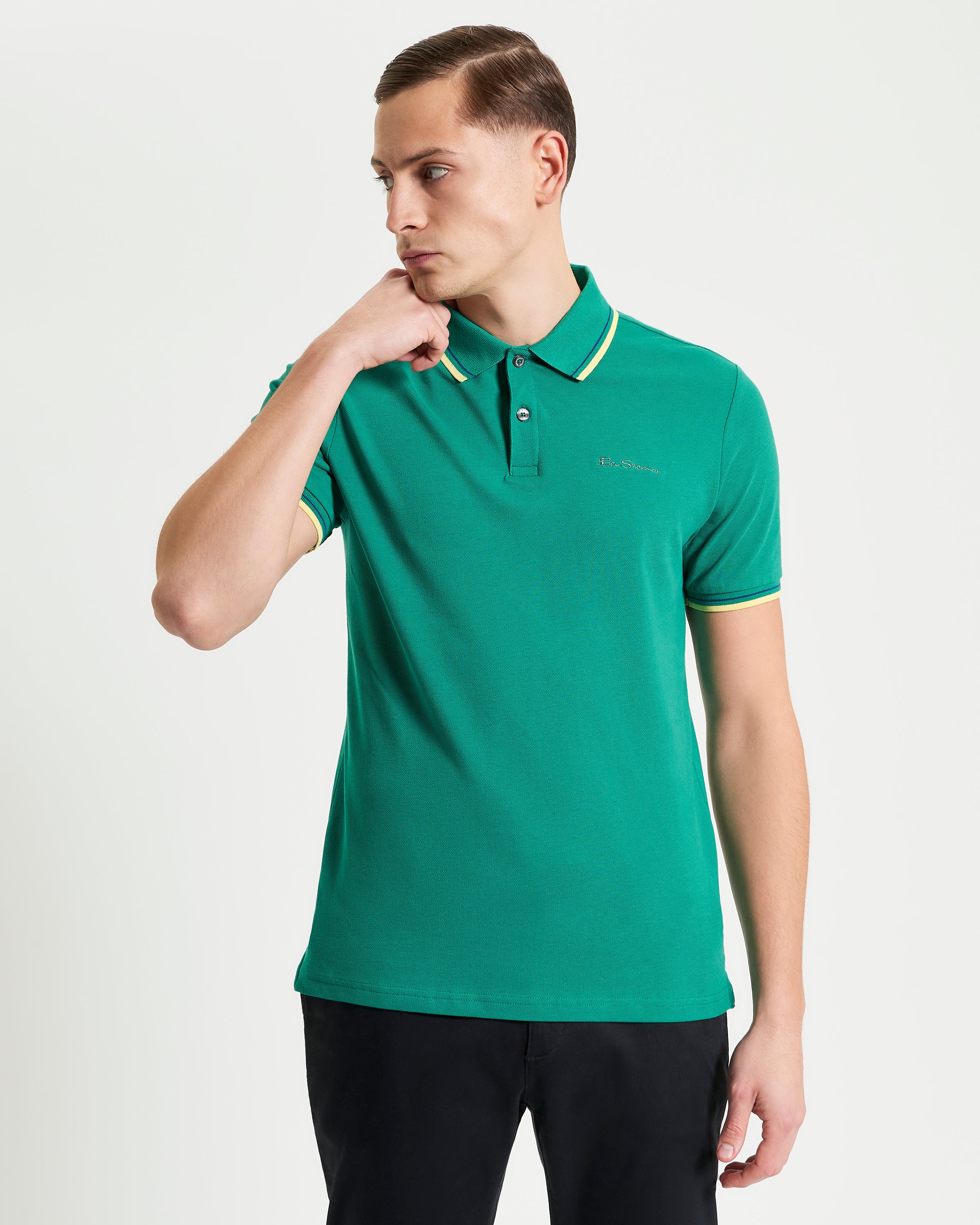 Signature Pique Polo – green polo shirt with contrast detailing, showcasing refined casual wear style.