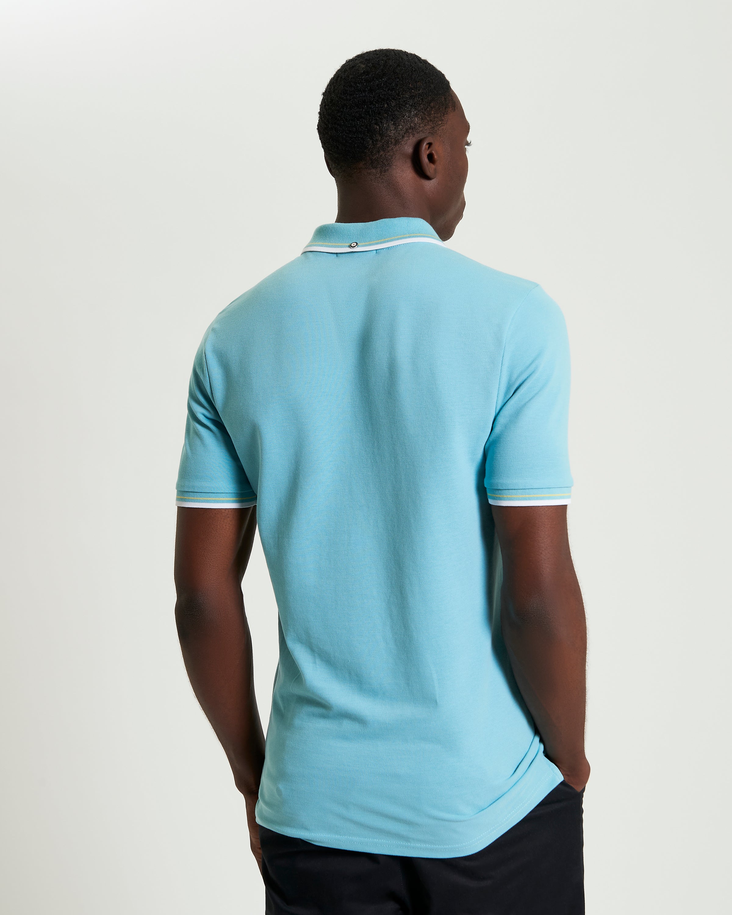 Signature Pique Polo – Back view showcasing stylish comfort and sustainable fashion.