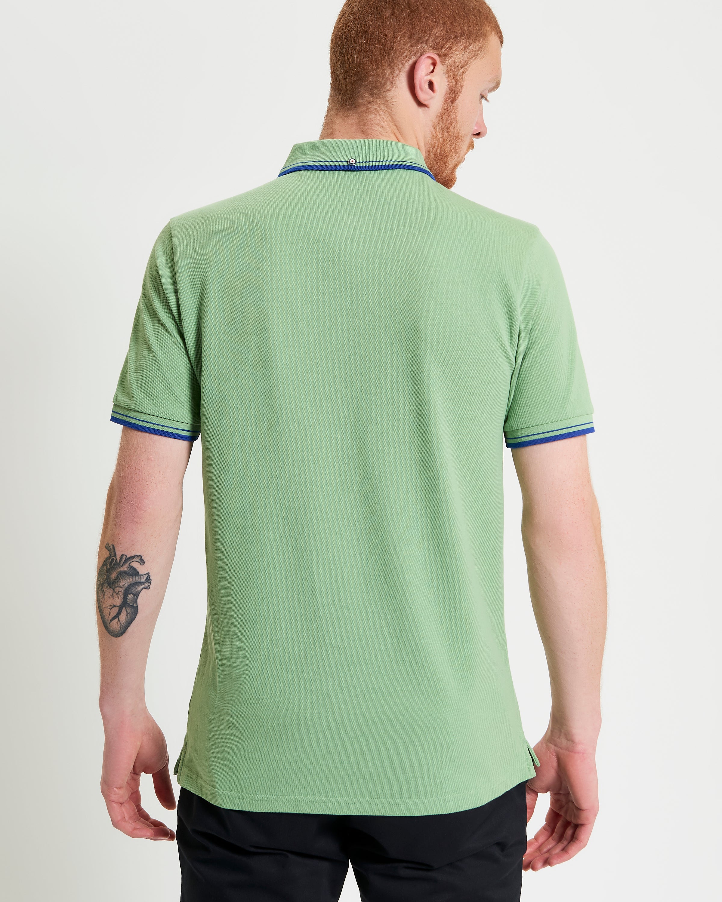 Signature Pique Polo – back view showcasing the green color and contrast detailing.